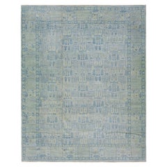 Tappeto moderno in lana fatta a mano di colore grigio in stile Khotan con motivo a trifoglio