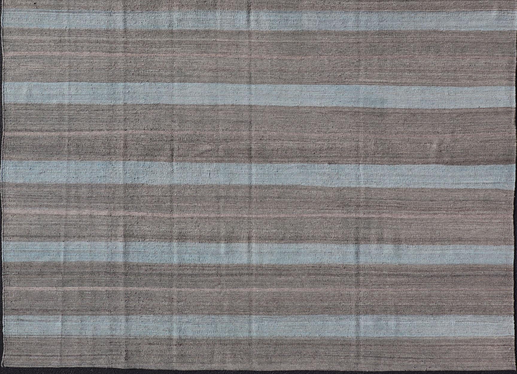 Flat-weave Kilim rug with stripes with modern design in shades of blue's, gray's, Keivan Woven Arts / rug AFG-25580, country of origin / type: Afghanistan / Kilim

This beautiful Kilim piece features a Classic stripe design that evokes casual and