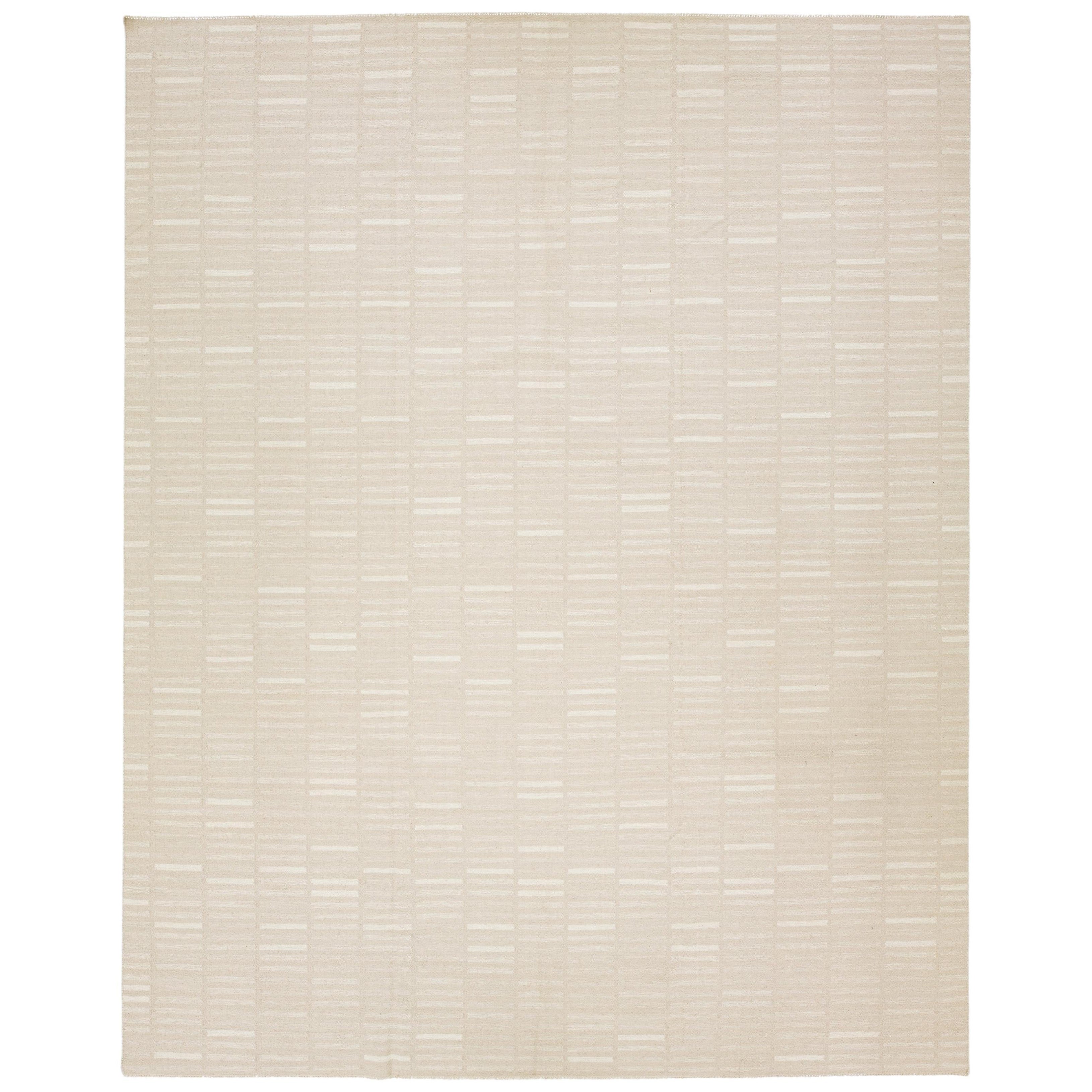 Tappeto moderno in lana a trama piatta Rug & Kilim in beige con motivo geometrico