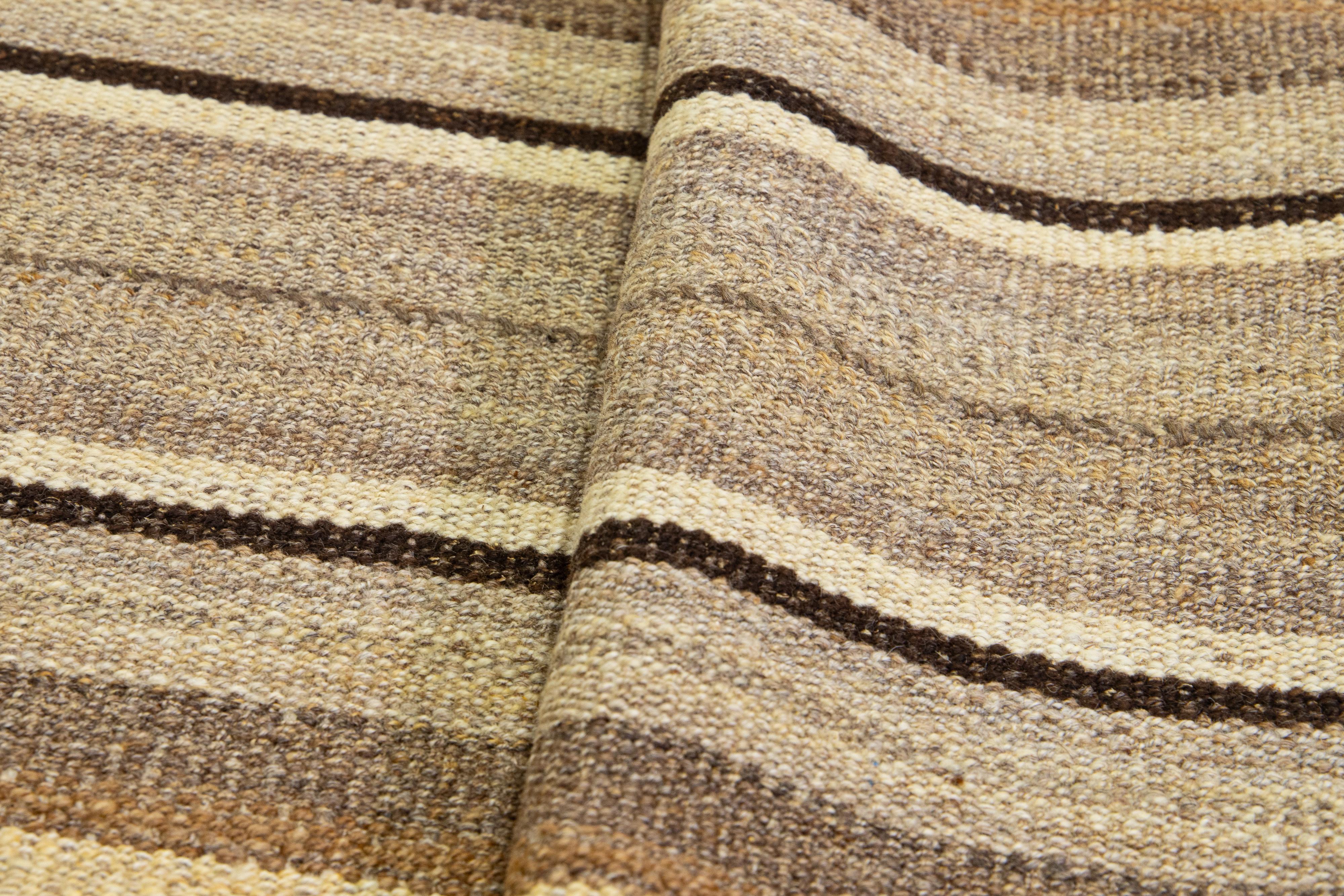 Wool Modern kilim flatweave wool rug with beige and brown stripes For Sale