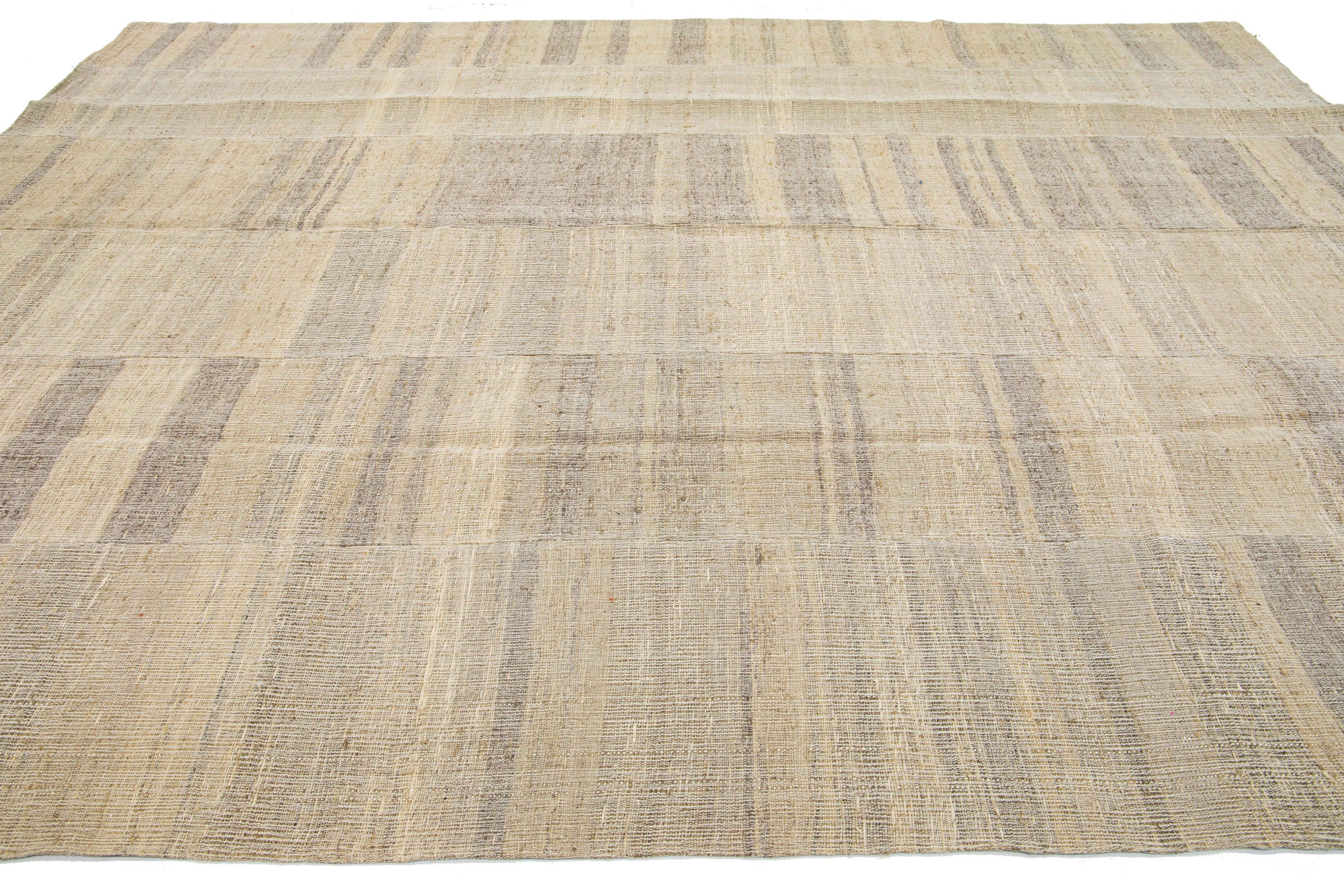 Indian Modern kilim flatweave wool rug with Beige Field  For Sale