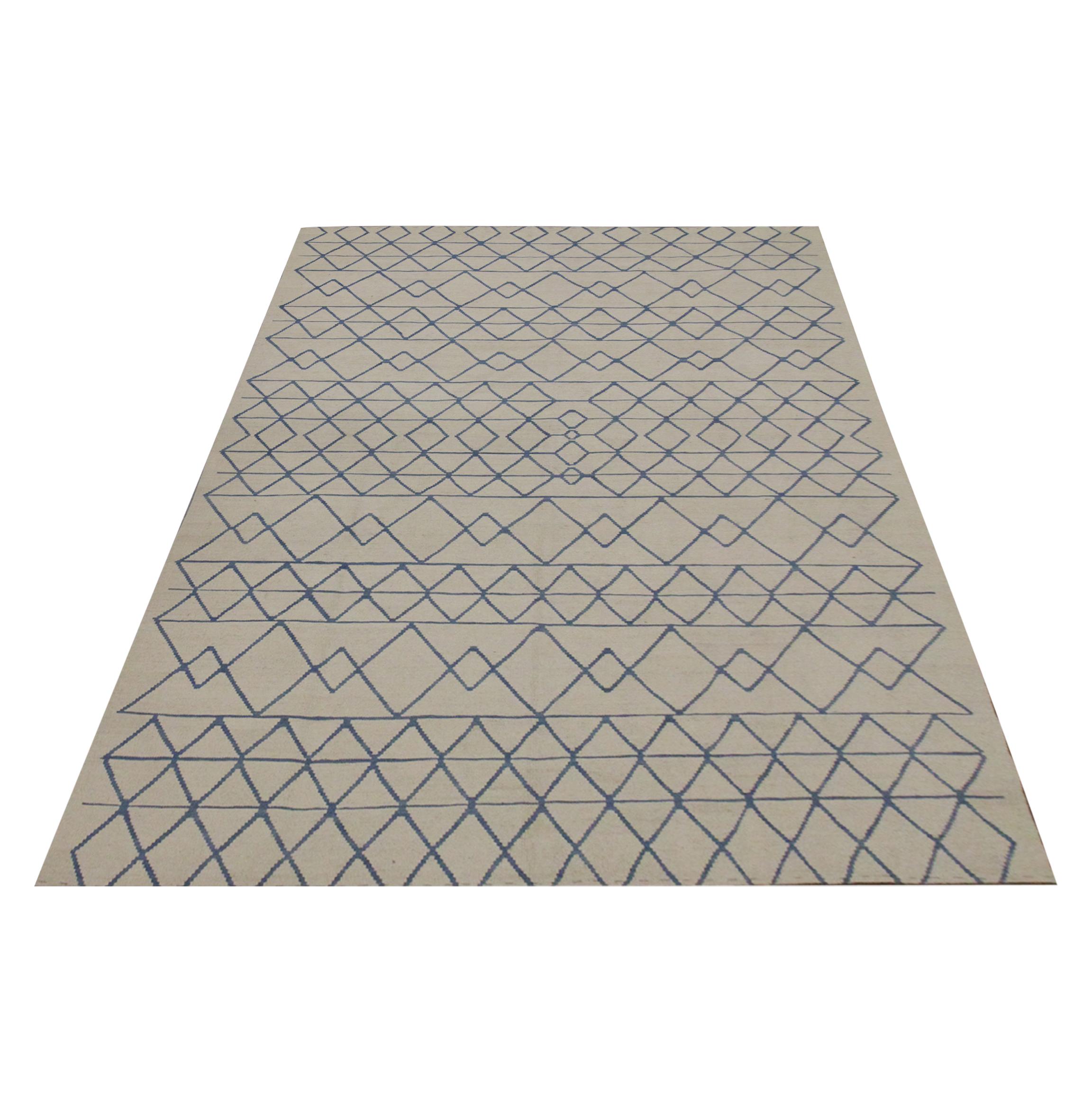 This fine wool Kilim is a New Modern Afghan area rug woven with a simple colour palette of cream and blue. The black accents make up the symmetrical geometric pattern, creating a bold, eye-catching rug. Similar to the Scandinavian design, this