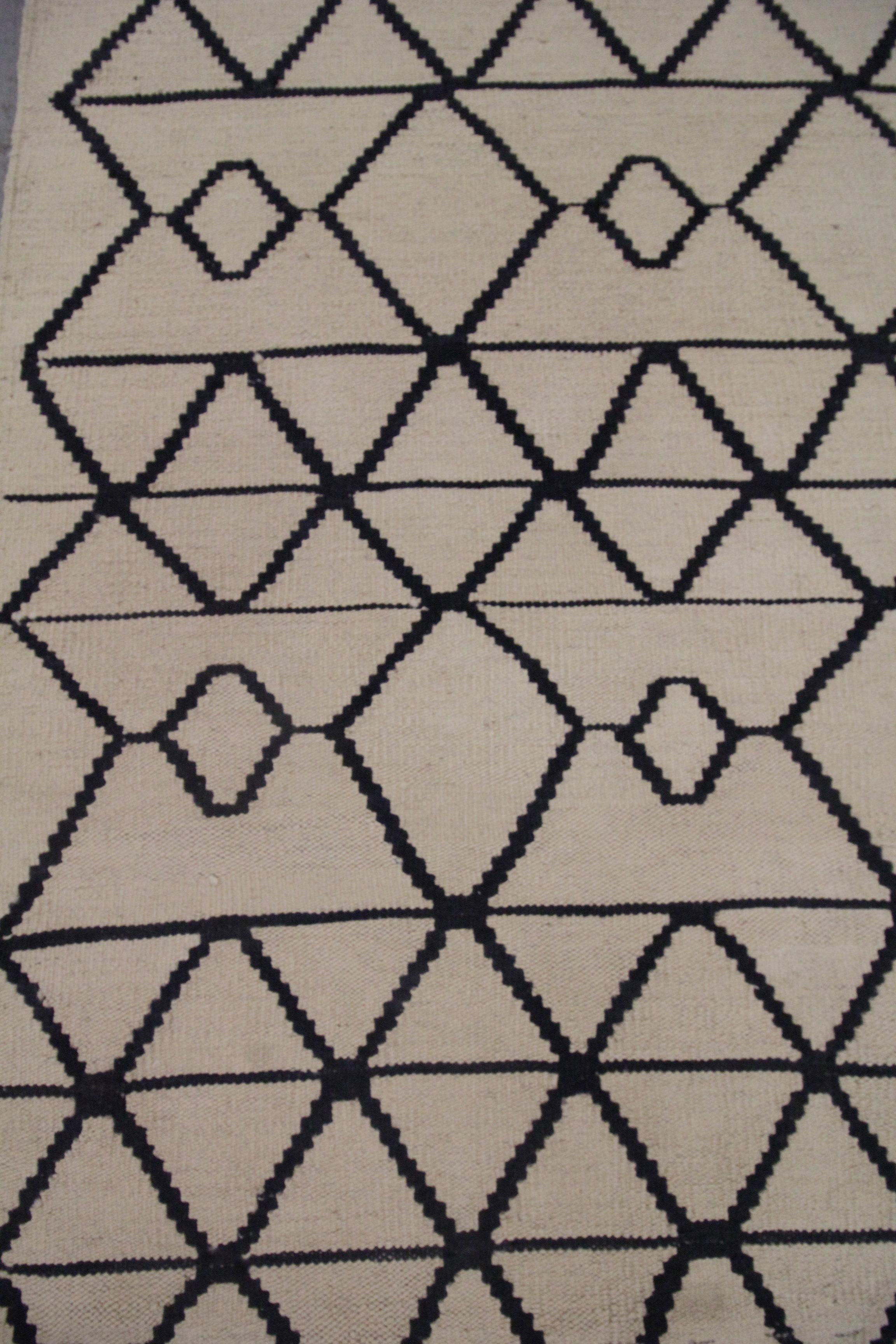 cream and black wool rug