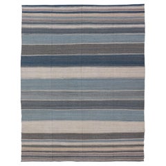 Alfombra Kilim moderna en tonos azul acero, verde azulado, marrón, gris claro y crema