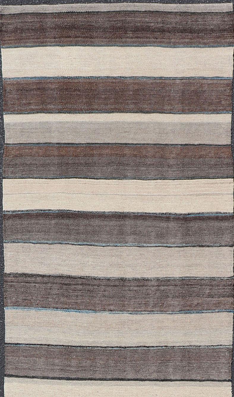 Flat-weave Kilim rug with stripes with modern design in shades of blue, taupe gray and cream, rug AFG-111, country of origin / type: Afghanistan / Kilim

This playful piece features a Classic stripe design that evokes casual and easy vibes.