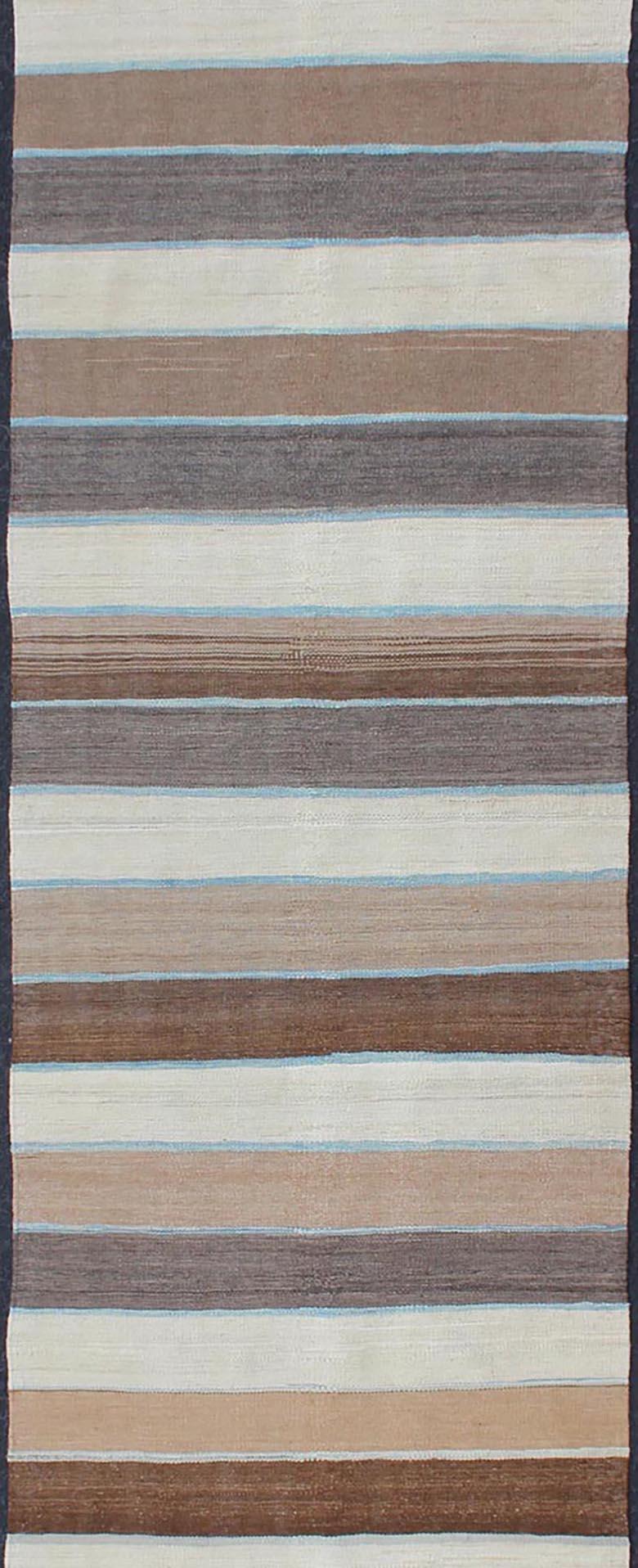 Flat-weave Kilim rug with stripes with modern design in shades of blue, taupe gray and cream, Keivan Woven Arts / rug afg-27738, country of origin / type: Afghanistan / Kilim

This playful piece features a Classic stripe design that evokes casual