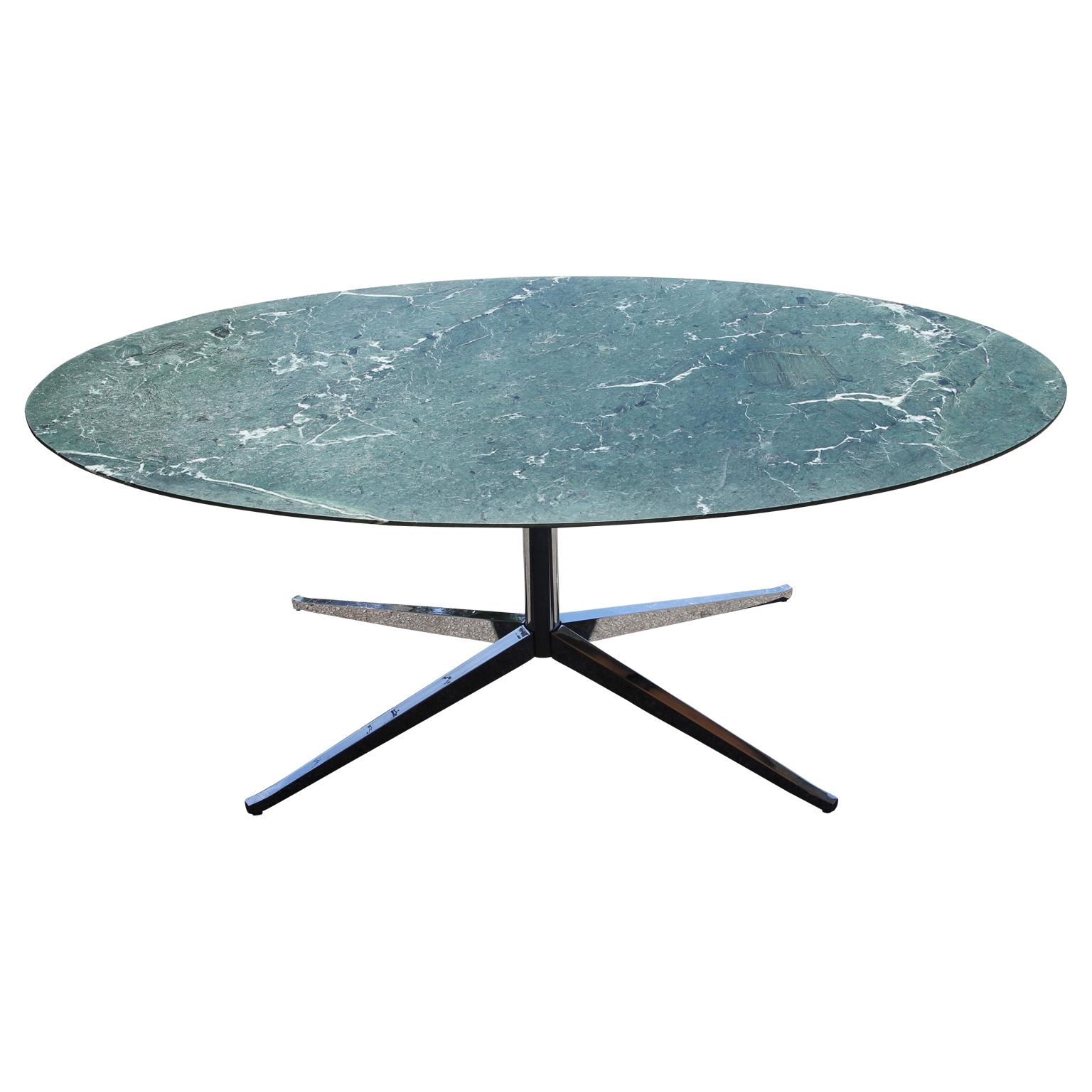 Large Knoll green marble oval top dining table with a unique green marble top. The table features a durable chrome base in a sleek modern design. The table is designed by Florence Knoll and is perfect for a dining table or conference table.
Top may