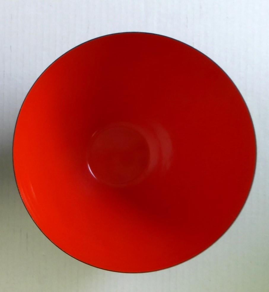 A large Mid Century Danish Modern Krenit Enameled Salad Serving Bowl in Tomato Red by Herbert Krenchel for Torben Orskov of Denmark from the 1960s.
The stamp on the bottom would sometimes rub off since the base is flat and the logo applied over the