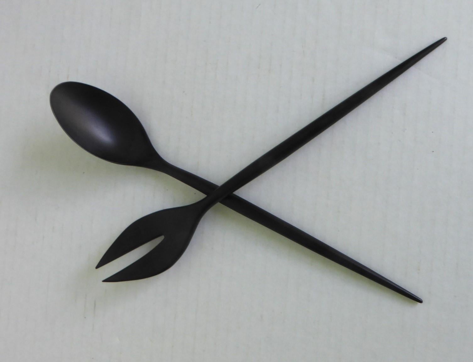 Fantastic set of Danish Mid Century Modern black Melamine salad serving spoon & fork utensils designed by Herbert Krenchel (1922-2014) in Denmark in 1950s.  They were made by Torben Orskov until 1964. The Krenit came in 9 sizes and numerous