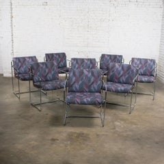 Set di 8 poltrone da pranzo moderne Steele con struttura in acciaio cromato e tessuto geometrico