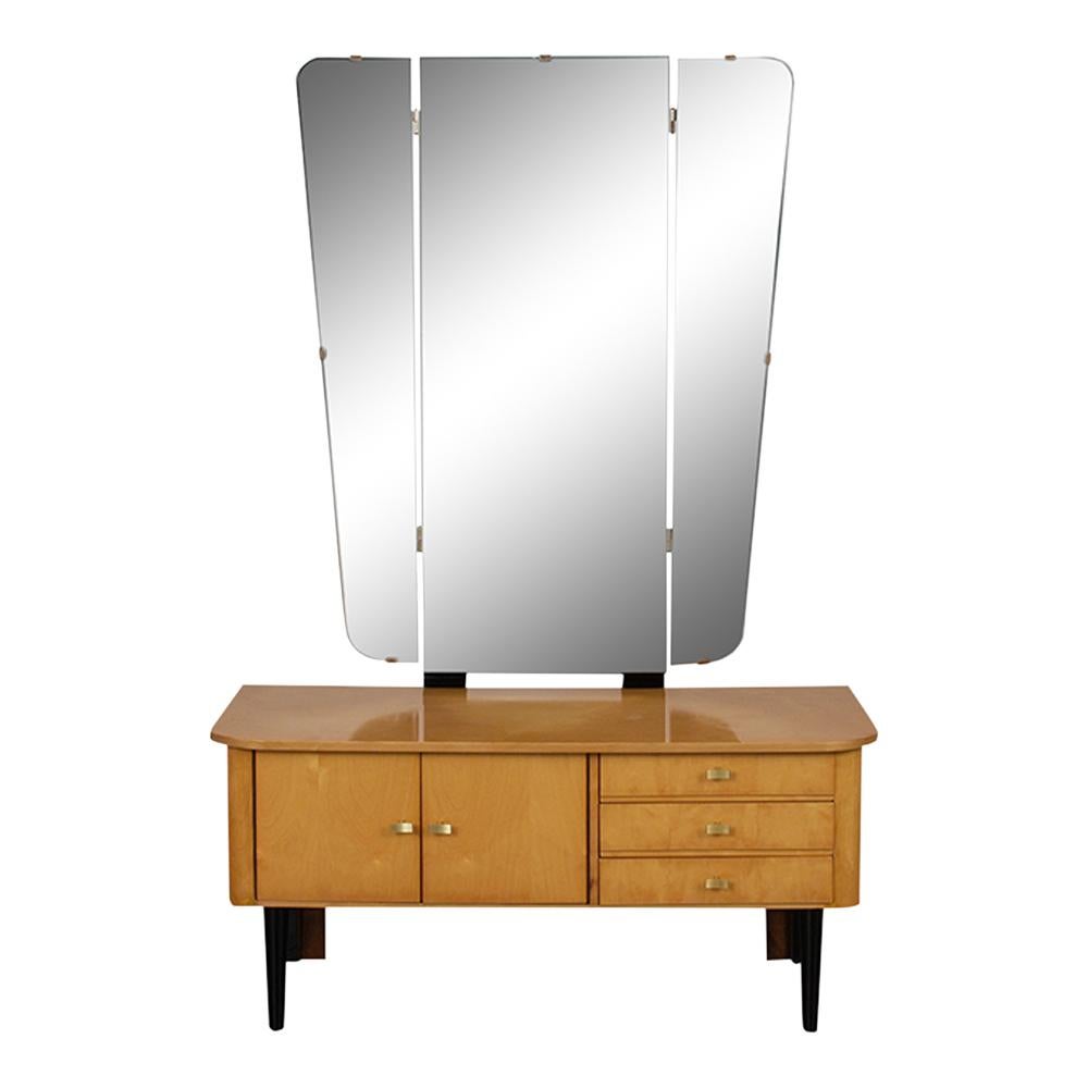 This 1960s modern-style German Vanity is made of maple wood that has been stained in a maple & black color combination with a newly lacquered finish. The dressing table has a large foldable mirror, features three pull-out drawers with brass pulls,
