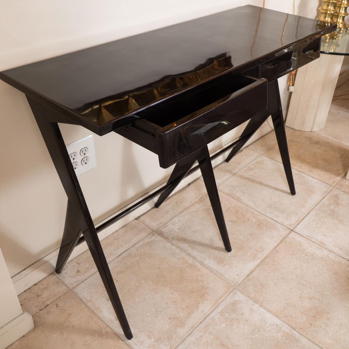 Modern lacquered wood two drawer console.