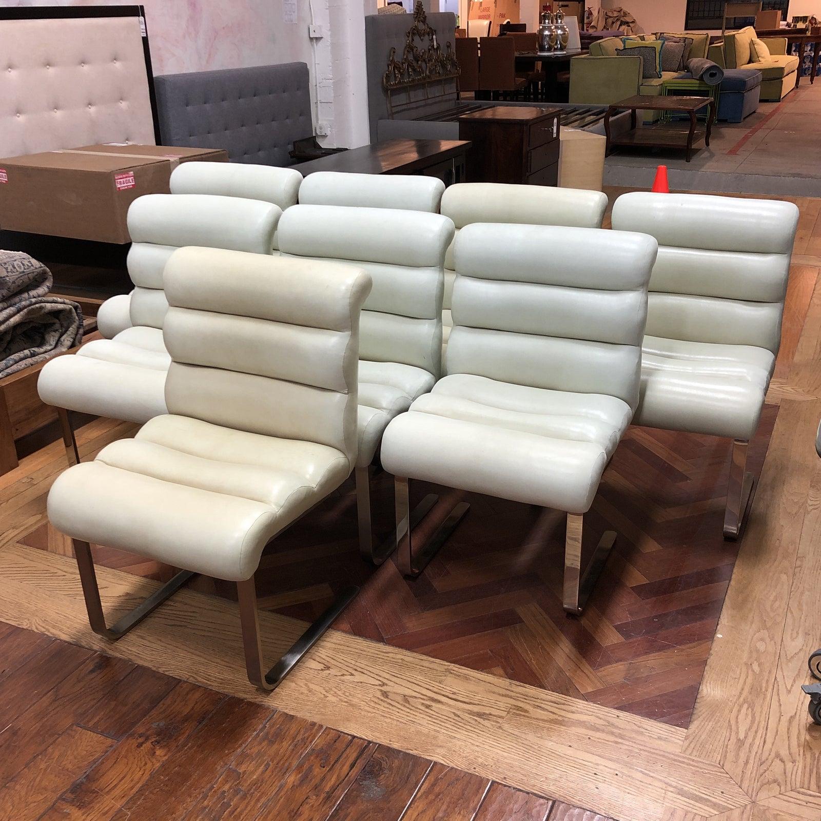 Design plus gallery presents set of eight Laguna Cantilever dining chairs. Designed by Frank Mariani for Pace Industries, the set is incredibly comfortable while remaining oh so mod. The chairs retain their original creamy bonded leather with some