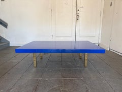 Modern large low bright blue high gloss lacquer coffee table with brass legs