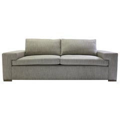 Modern Large Sofa with Large Pull Out Table and Metal Details on Wood Legs