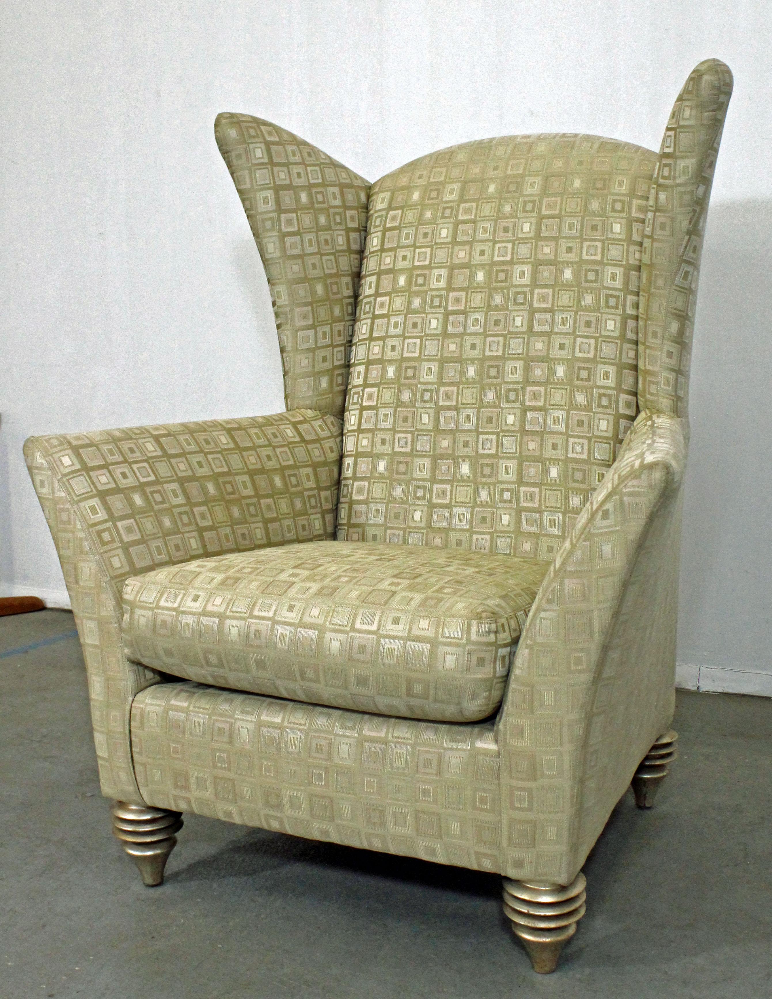 What a find. Offered is a unique modern wing chair designed by Larry Laslo for Directional. This chair features uniquely sculpted 'wings' and feet. It is in good condition, showing normal age wear (see pictures). It is signed Larry Laslo for