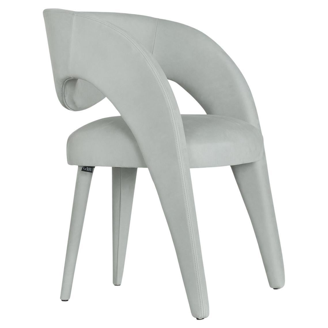 Laurence Chair, Contemporary Collection, Handcrafted in Portugal - Europe by Greenapple.

The Laurence leather dining chair is an artistic tribute to the essence of femininity in contemporary design. With its elegant and daring silhouette, this