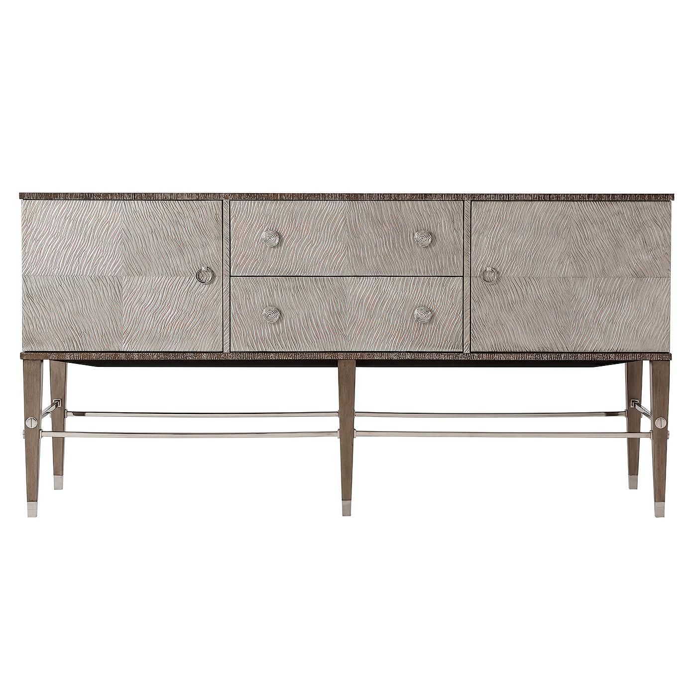 Modern Cerused quartered oak cabinet with two mercury finish embossed leather drawers and doors, stainless steel handles, and stretchers on hand leafed brushed pewter legs.
Dimensions: 72