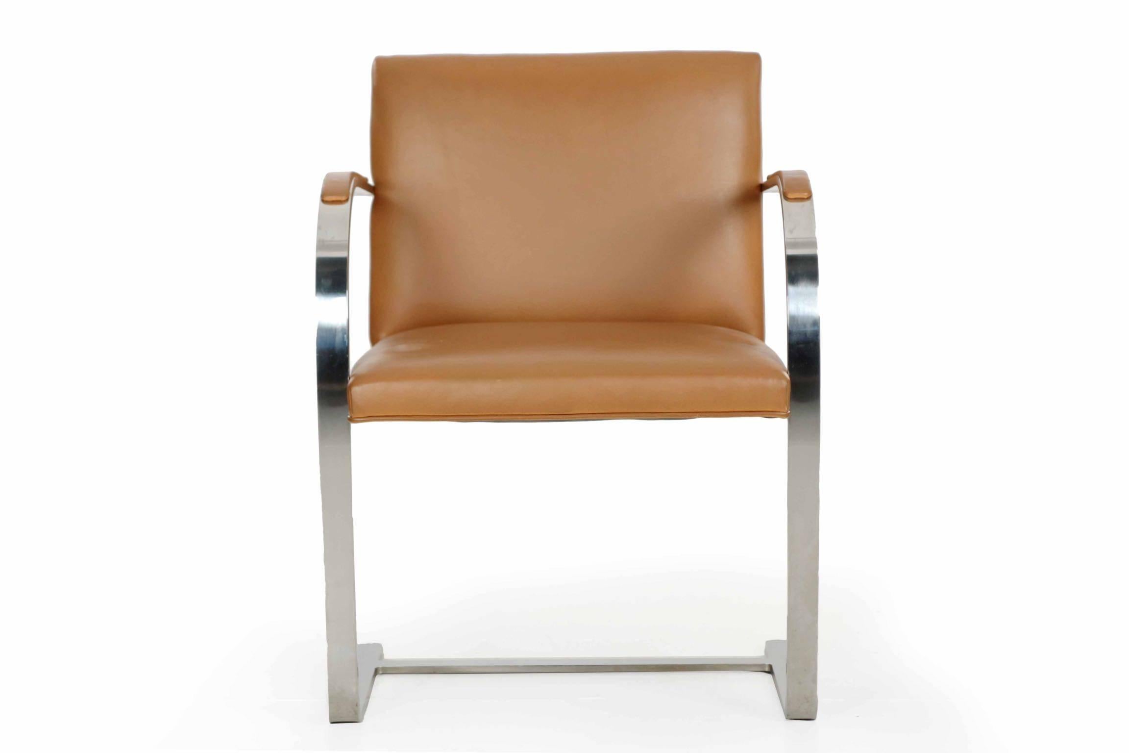 An iconic and very finely fabricated chair, this BRNO flat bar armchair was designed by Ludwig Mies van der Rohe and manufactured by Knoll in stainless steel. The chair is stamped KP underneath the flat feet for Knoll Productions. It is expertly