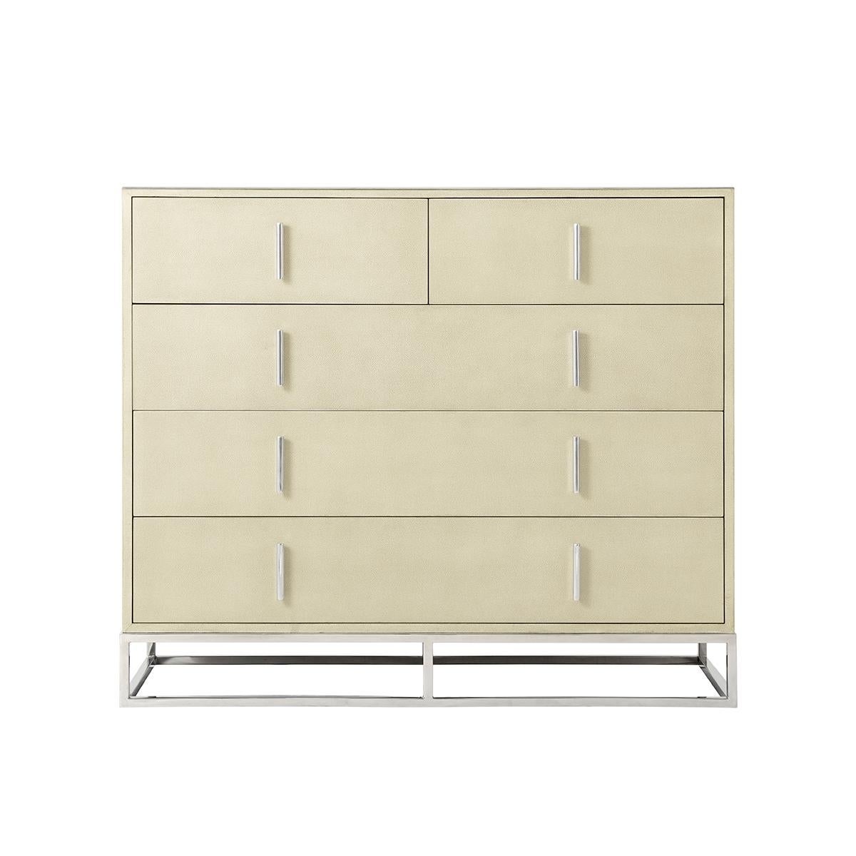 Modern Leather Chest of drawers with a shagreen embossed leather wrapped case in our light overcast finish with two short above three long drawers, polished nickel finish hardware and cube base.

Dimensions: 50