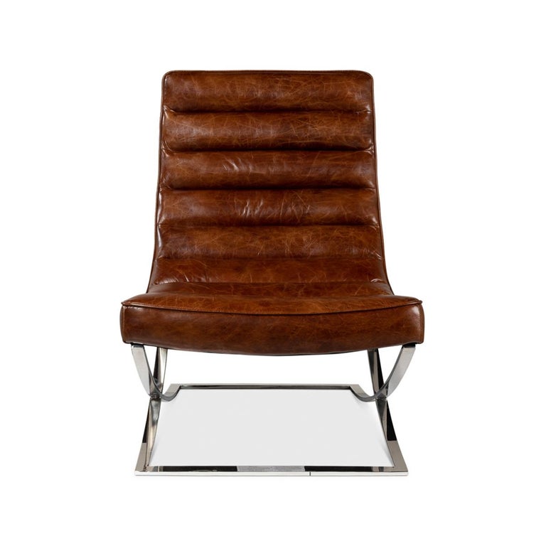 Modern Leather Lounge Chair with a channeled pure aniline top-grade antiqued brown leather, on a modern silvered stainless steel X form base.

Dimensions: 26