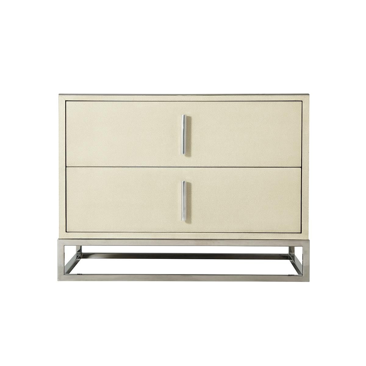 Modern leather nightstand with two drawers, a shagreen embossed light overcast finish leather and polished nickel finish hardware and an open cube base.

Dimensions: 29.5