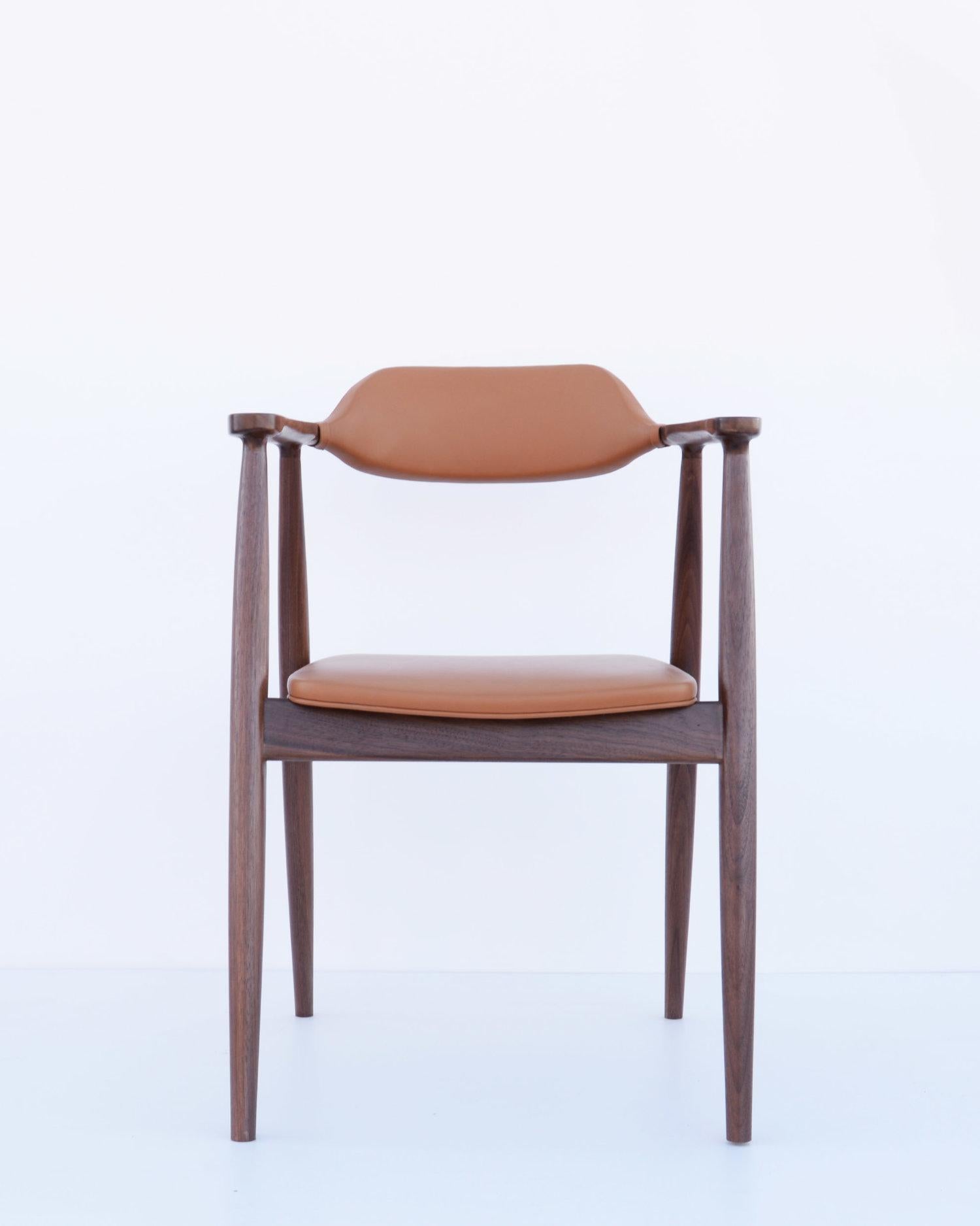 Materials : 
[First Photos] 
Bleached white oak polyurethane finish 
Light brown natural leather with 1” form cushion upholstery seat and chair back
Materials : 
[Second Photos]
Solid walnut Polyurethane finish 
Light brown natural leather