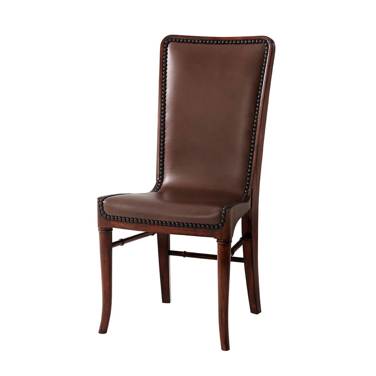  the upholstered sling back and seat with nailhead decoration, the reverse with hair on hide leather, on turned and splayed legs.  

Dimensions: 19.75