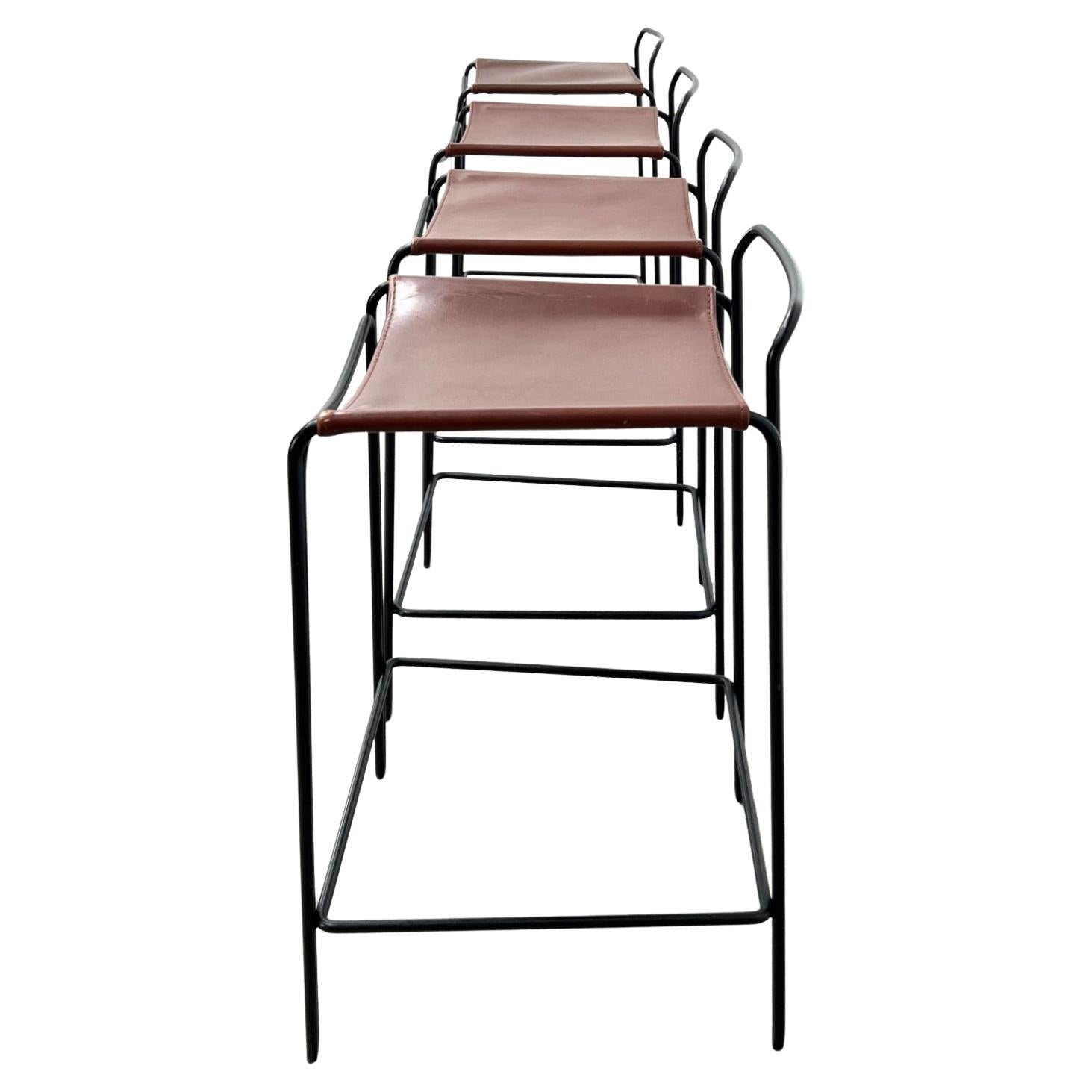 Modern counter height Trace stools in brown leather with black iron frame by Mark Daniel Design. Great leather sling minimalist design with black lacquer steel frames good pre owned condition. Located in Brooklyn NYC 

(4) stools available