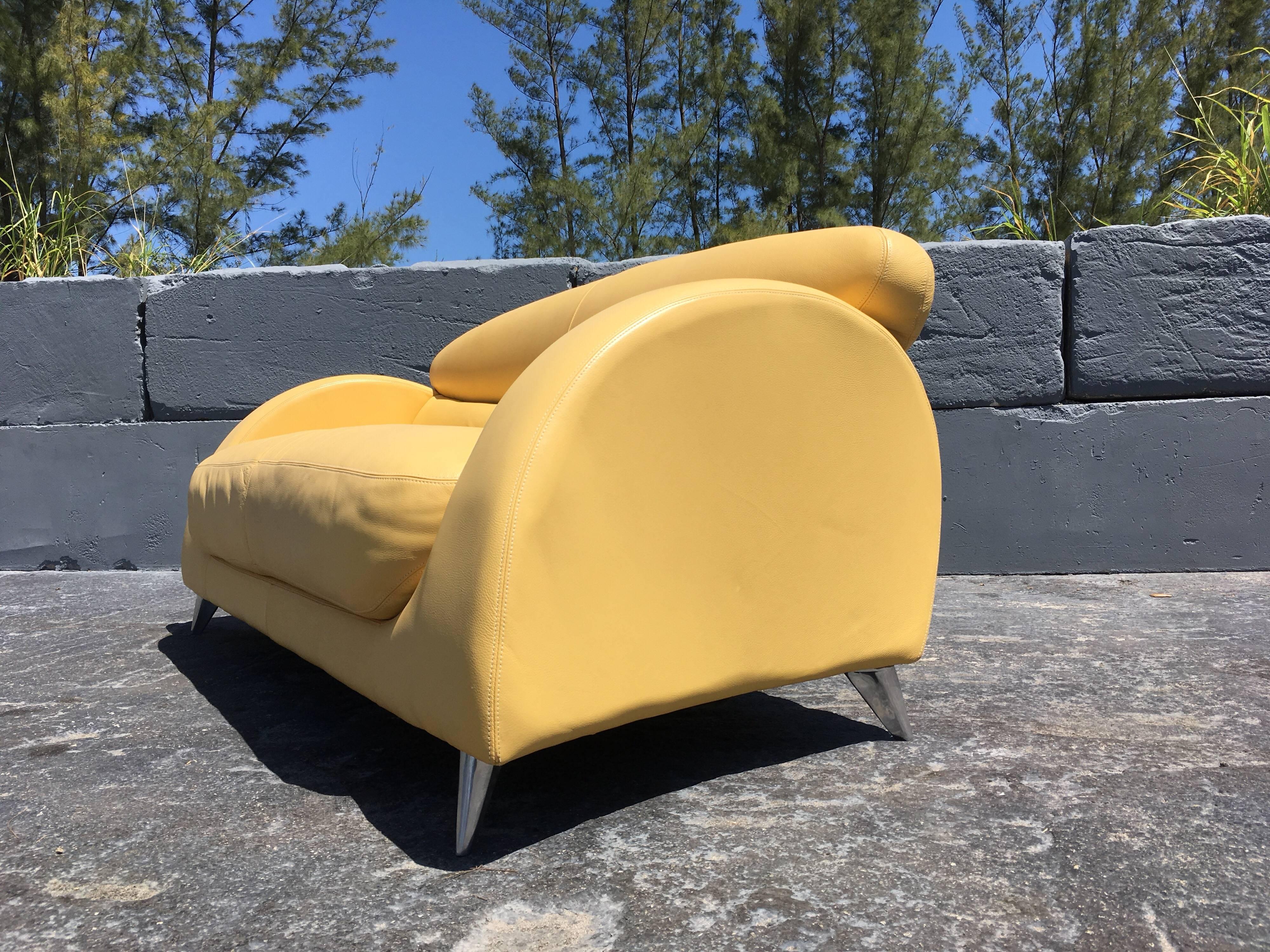 Modern Italian yellow leather sofa on aluminum legs.