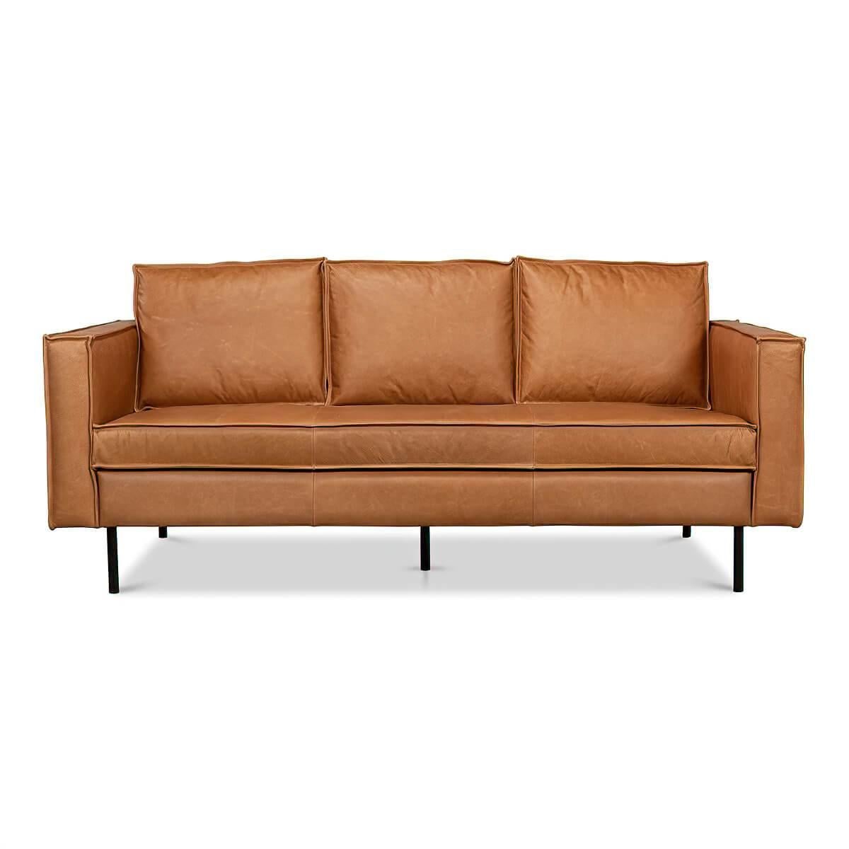 An Italian Mid-Century Modern style leather upholstered sofa with a bold box form raised on a minimalist iron leg base.

Dimensions: 74