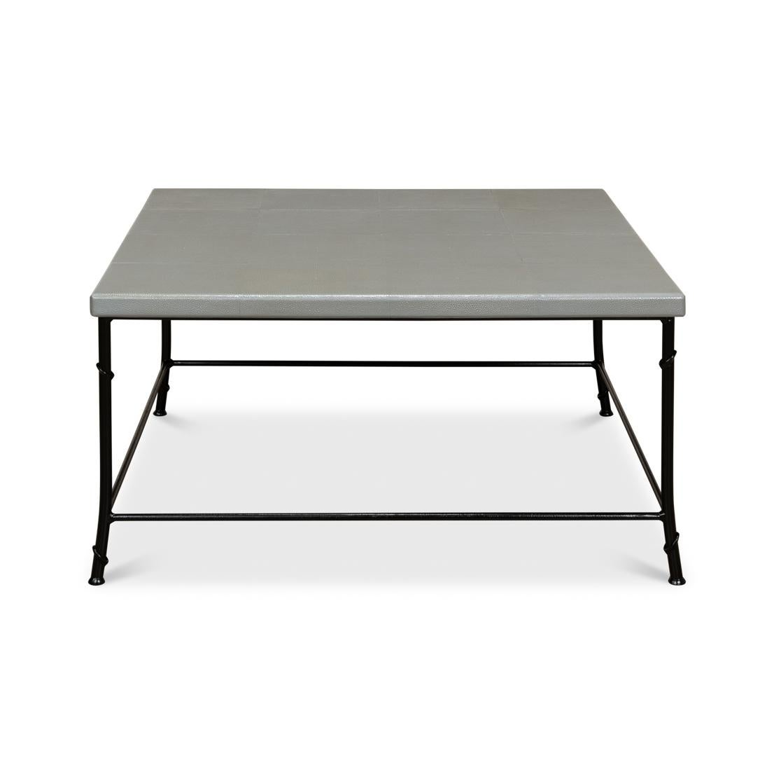 Featuring a sleek, square gray embossed leather top that exudes a chic, industrial vibe. The minimalist black natural-form frame adds an air of sophisticated simplicity, making it a versatile fit for any living space. 

The spacious top is perfect