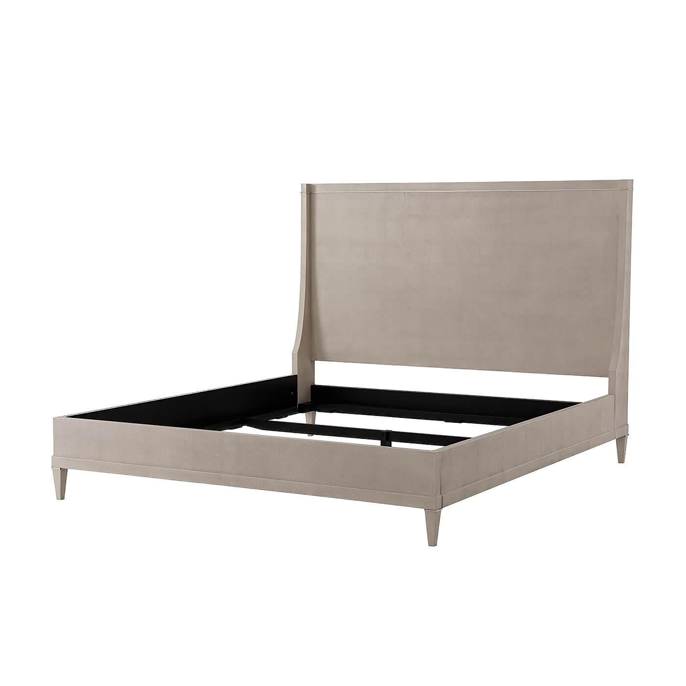 A modern embossed overcast finish leather-wrapped California king size bed with a winged end headboard, polished nickel molding detail inlays and a stepped rail frame with square tapered legs.
Dimensions: 77.5
