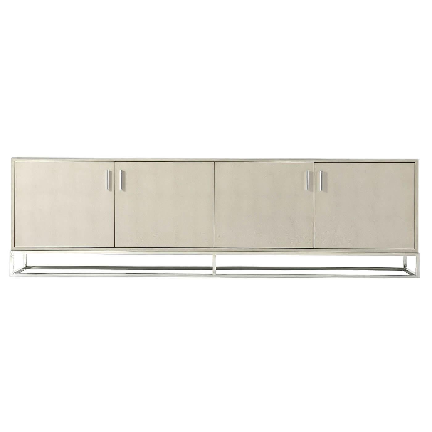 Modern shagreen embossed leather wrapped media cabinet, in our lighter overcast finish, with four cabinet doors enclosing shelves and with brushed nickel finish open cube base, molding, and handles.

Dimensions: 94.5