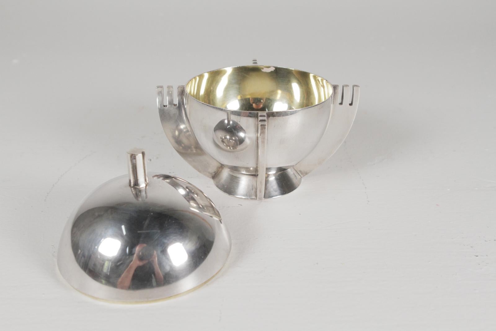 An iconic Royal Apple silver plate sugar bowl designed by artist Julia Keilowa of Warsaw. Made by the J. Fraget silver company of Warsaw Poland. The design won the ministry of foreign affairs award 1935 and the international art and technology in