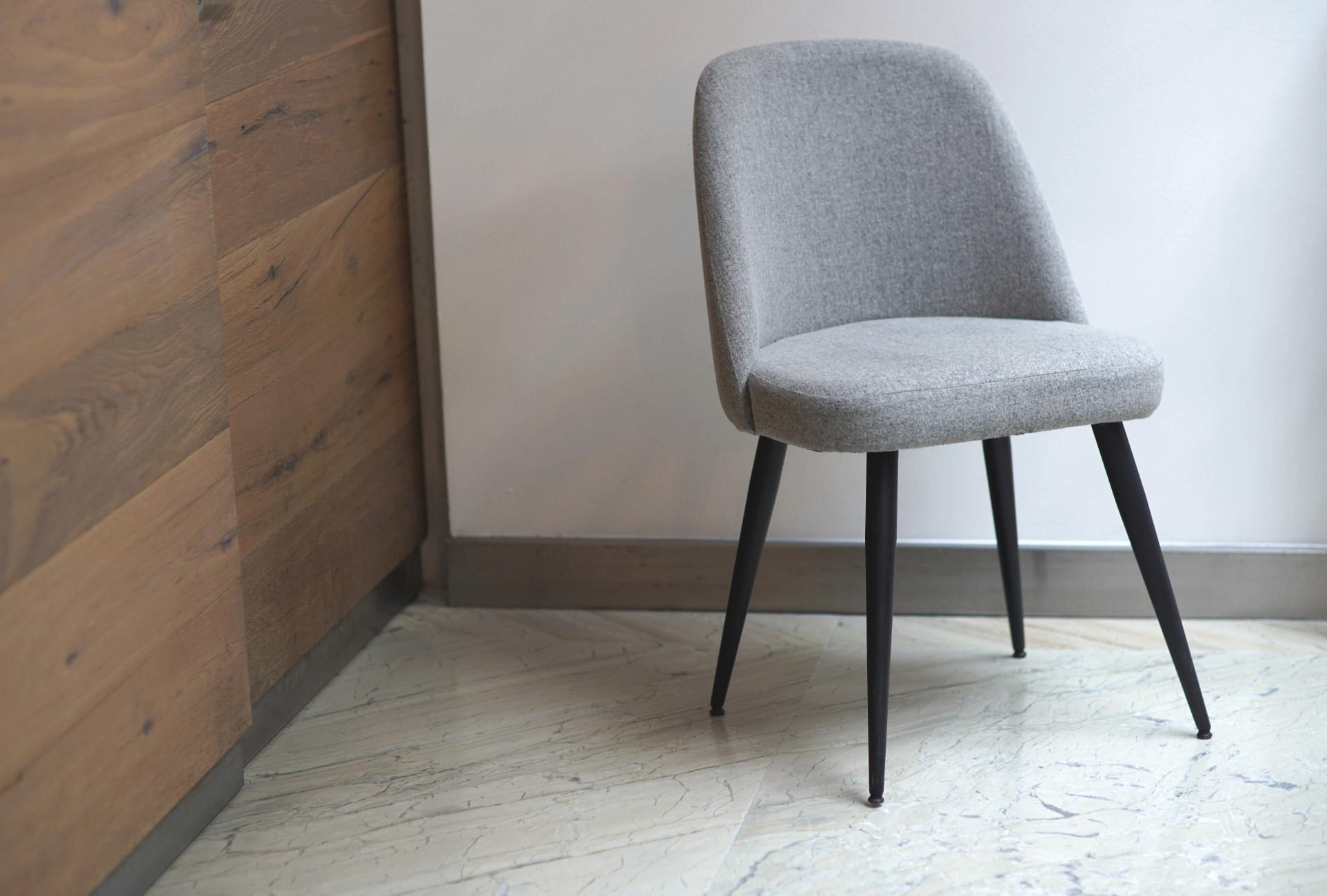grey fabric dining chairs with black legs