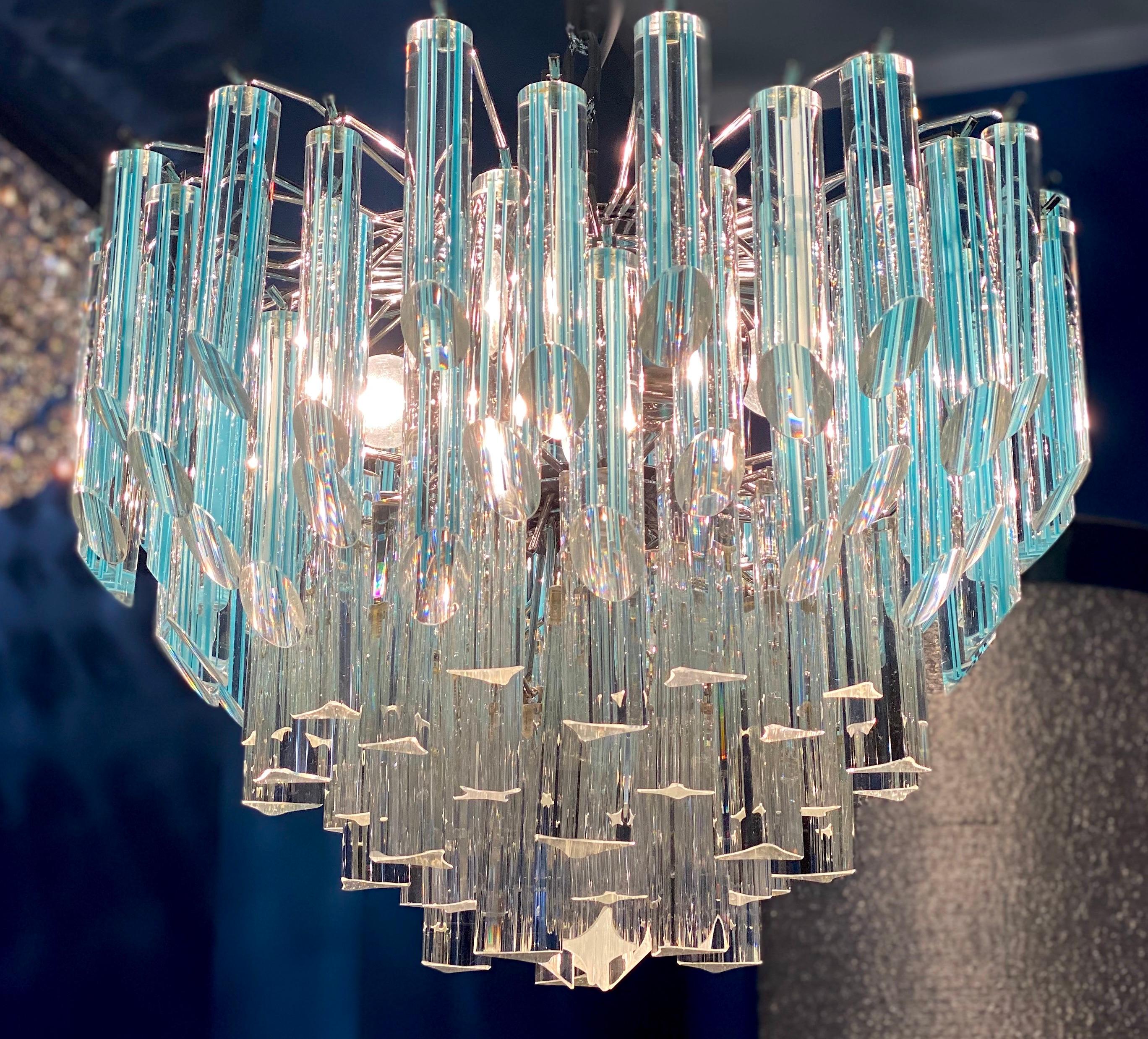 Amazing multitier triedi crystal chandelier, with light blu pendants, 1970.

Height:
45 cm glass + 40 cm chain = total height 85 cm.
Diameter:
(45 cm).