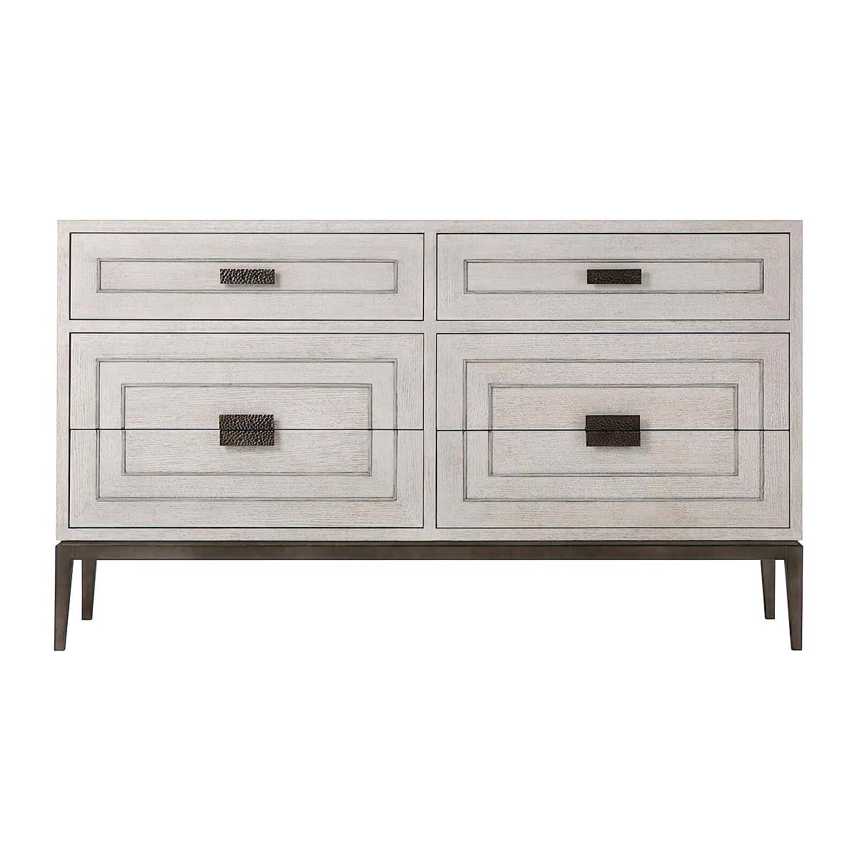 Modern light oak dresser, a six-drawer chest of drawers in our light brushed oak gowan finish with two frieze drawers above and four larger drawers below. Each with relief inlaid angular centric lines and hammered metal handles with matte tungsten