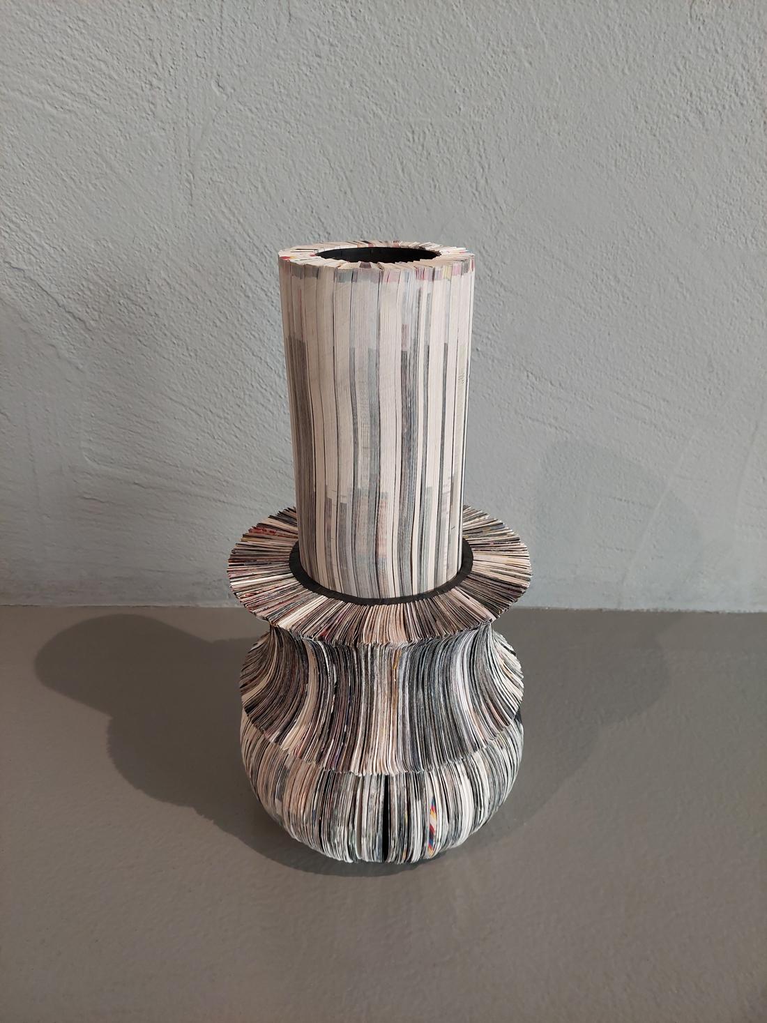 Sculptural vase from Paperwords collection made of strips of cardboard used for proofreading typographical printing sheet. Paper recovered and reused. Cut profiles reveal signs, inks, word traces and images.

Composition of three separated elements