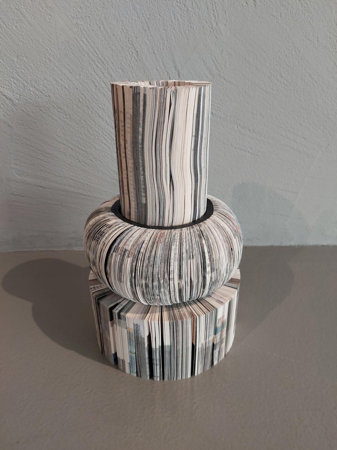 Sculptural vase from Paperwords collection made of strips of cardboard used for proofreading typographical printing sheet. Paper recovered and reused. Cut profiles reveal signs, inks, word traces and images.

Composition of three separated elements