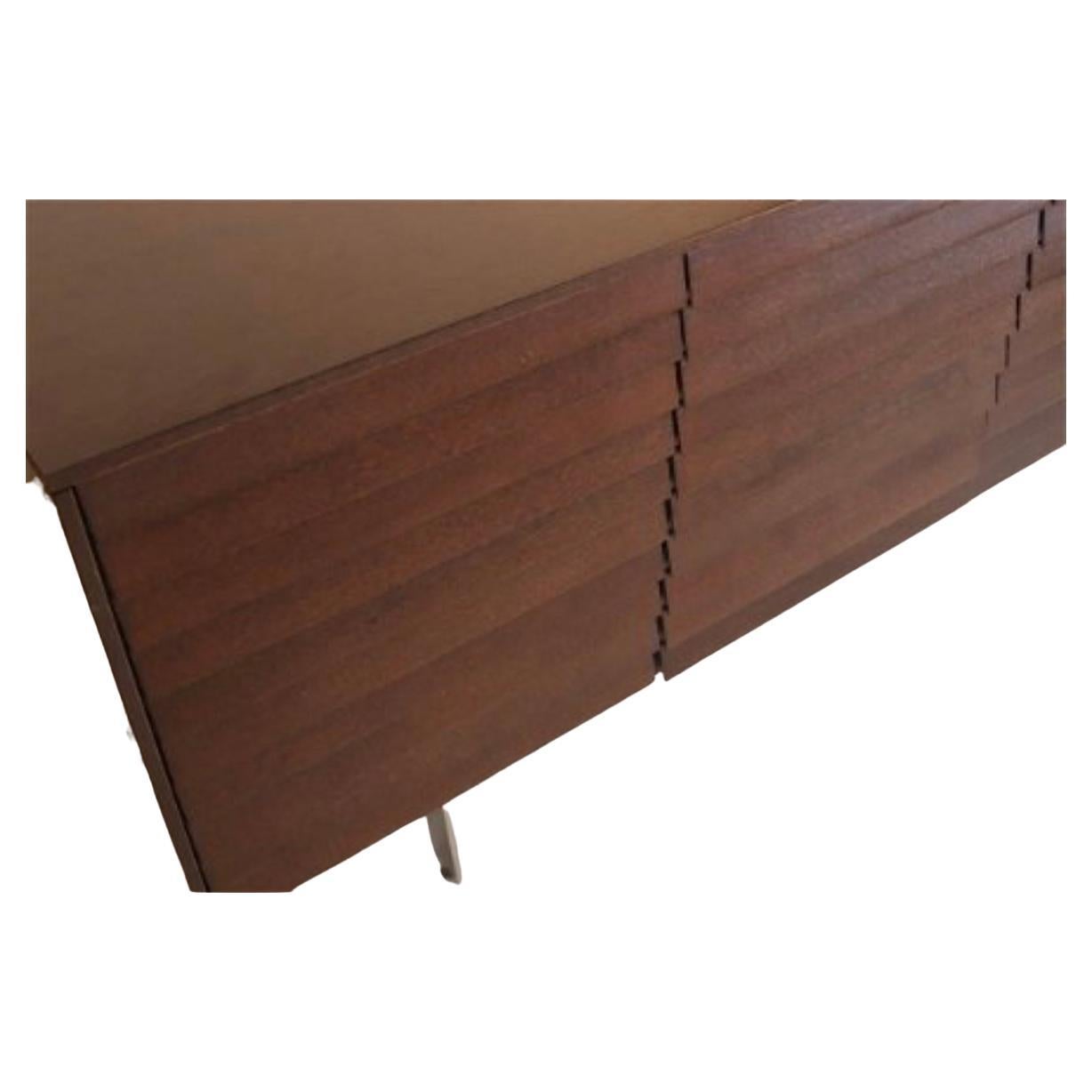 Pre owned Modern Sussex Walnut Credenza Sideboard designed By Terence Woodgate made by Punt Mobles. Dark walnut finish credenza with 4 louver front doors. Sits on 4 steel chrome plated flat bar legs. Has multiple adjustable shelves and plenty of