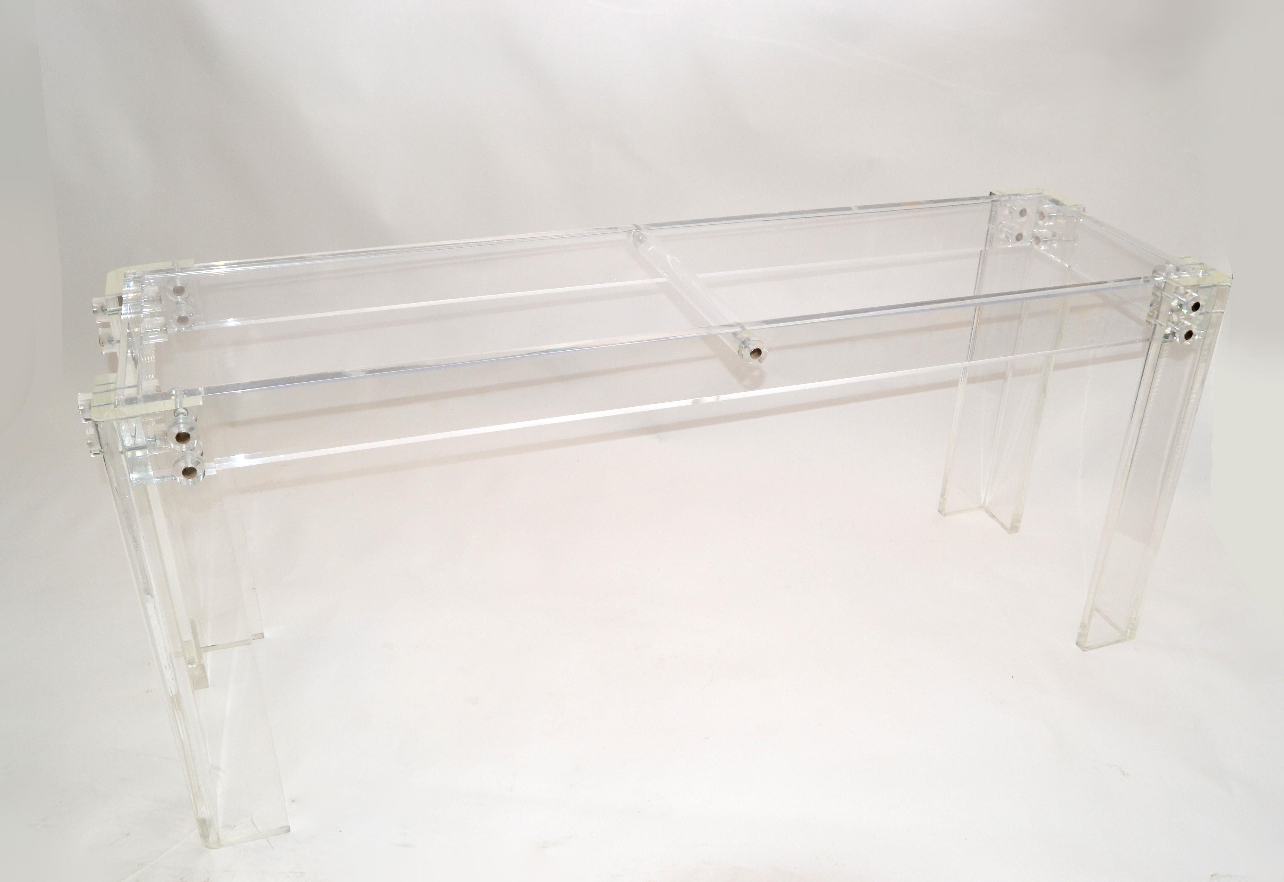 Contemporary long clear Lucite console or hallway table made in the 1980s.
It has a acrylic top for display your finest art and sculptures.
Fits to any Mid-Century Modern design and interior.
The vases are decoration and not included.