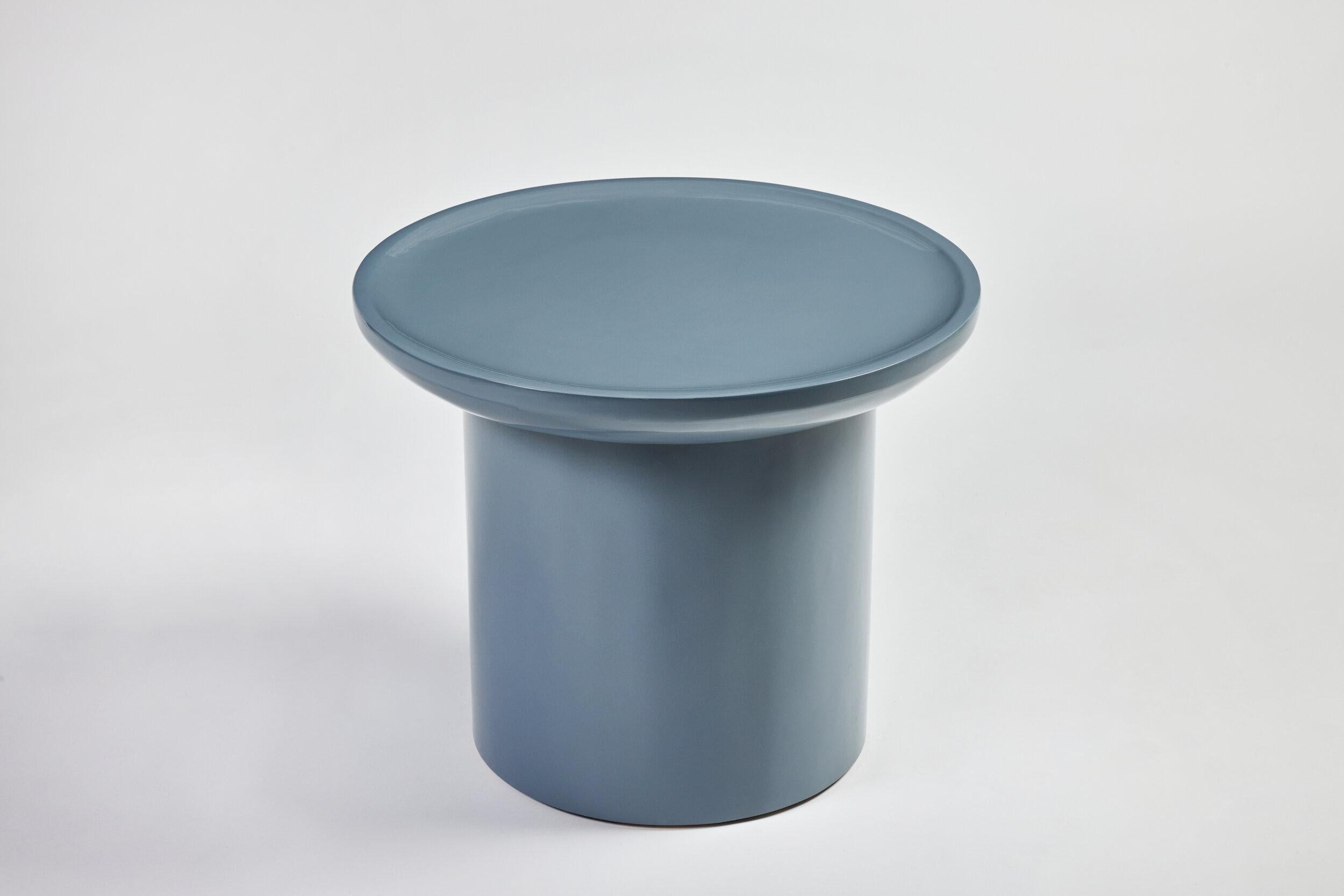 Martin & Brockett's Findley Round Low Side Table features the collection's signature curved lip and round base. Shown in Glacier blue hand polished high gloss lacquer 

H 19.75 in. x W 24 in.

Part of our Findley Collection.

Lead time: 15-16 weeks