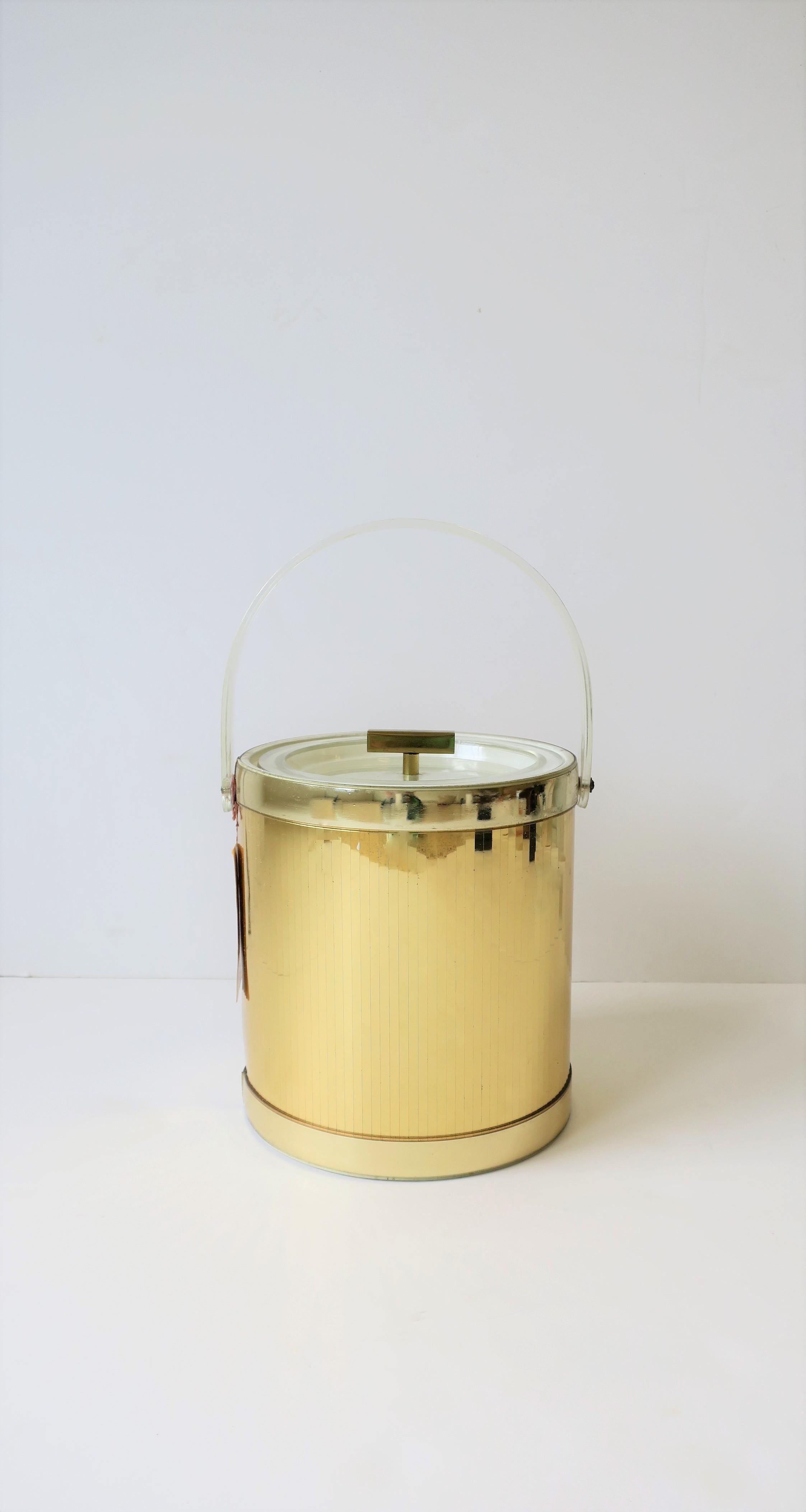 A chic 1970s modern clear acrylic and gold disco era ice bucket by designer Georges Briard, circa 1970s. Piece appears to have never been used. Original tag. Colors include clear, gold and white. A great entertaining piece, indoors or out.