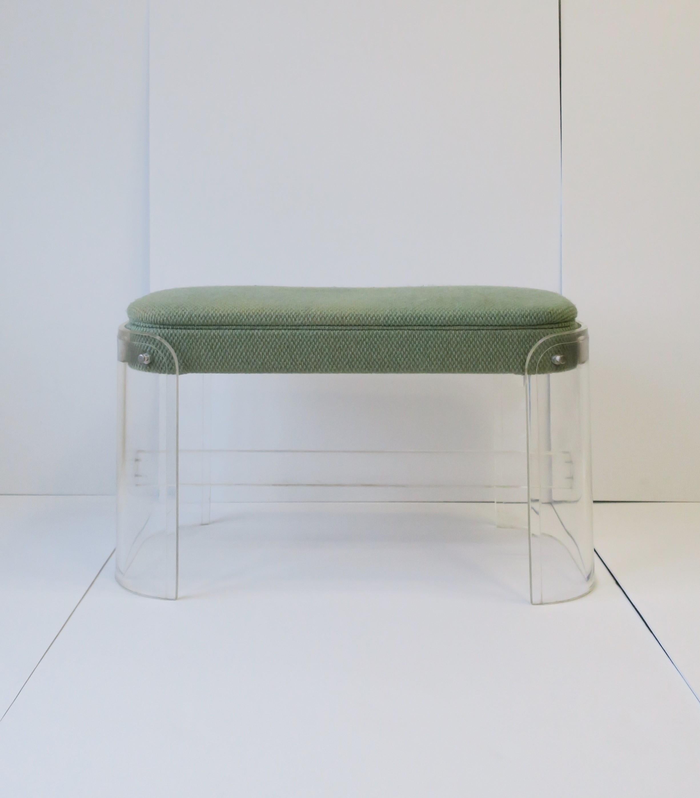 A 1960s Modern Lucite and upholstered bench in the style of designer Charles Hollis Jones, circa 1960s. Rounded soft corners and stretcher base. Piece is a nice size as a standalone bench or as a vanity seat. 

Bench measures: 17.25