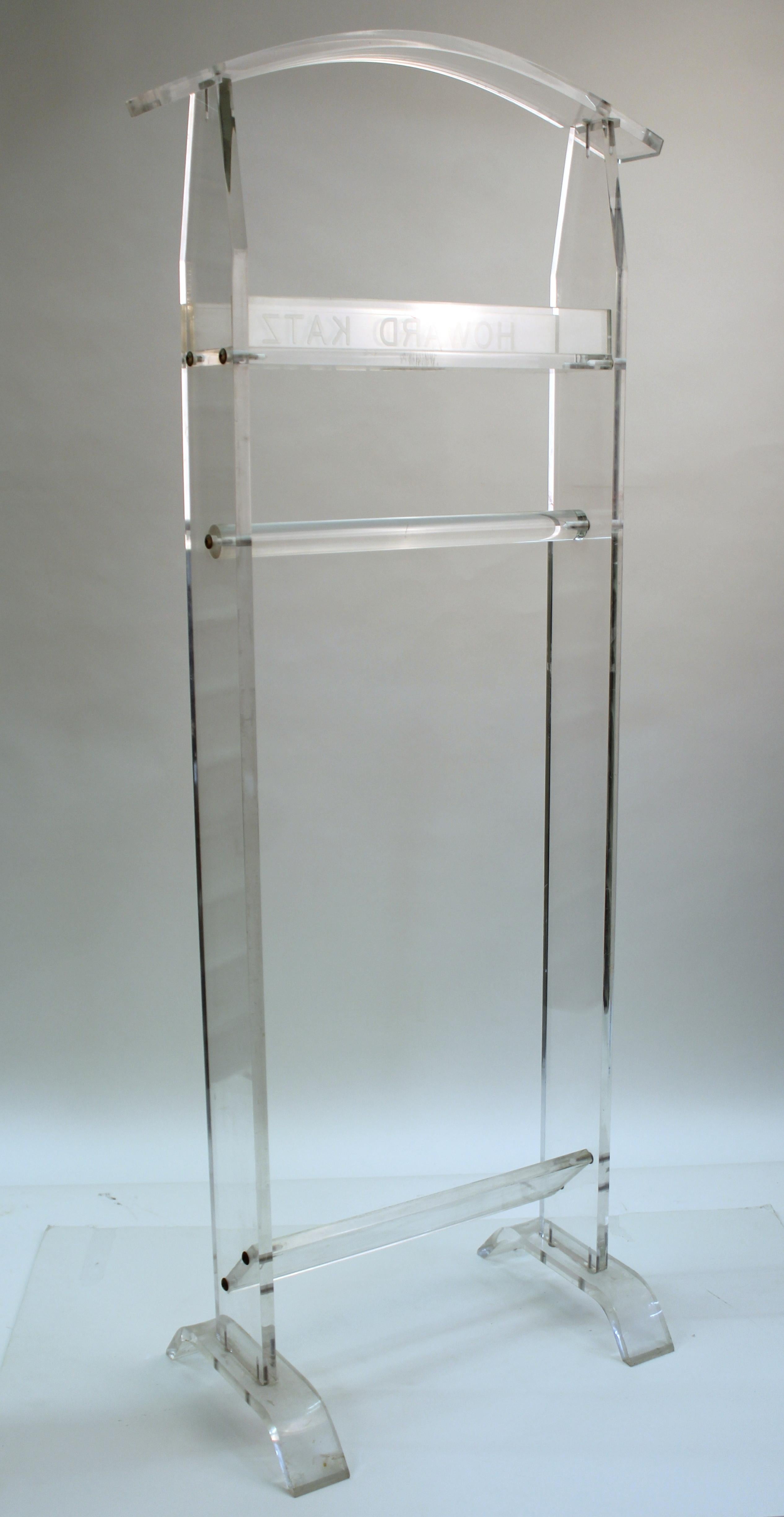 Modern valet in Lucite with engraved name of 'Howard Katz' on the front. The piece has a slanted Lucite board on the lower part to place shoes. In good vintage condition, with age-appropriate wear to the Lucite.