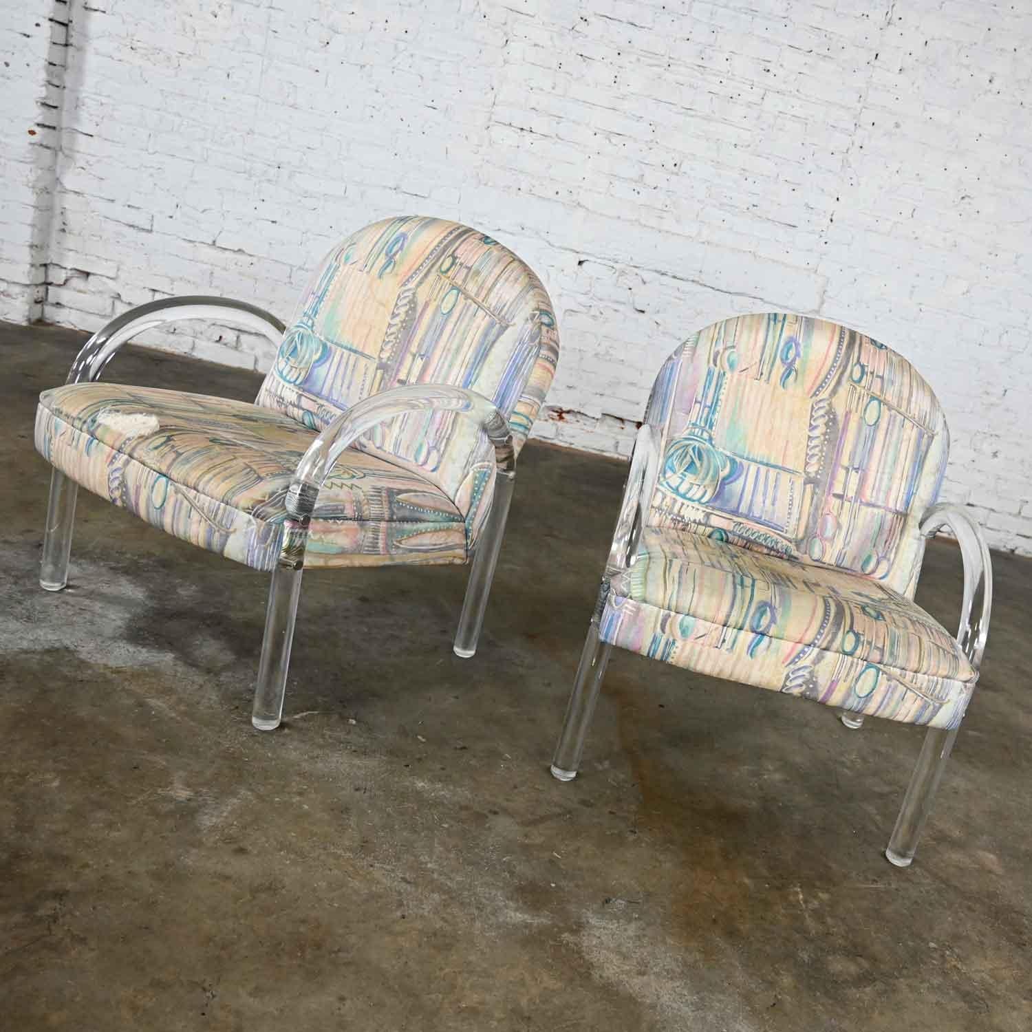 Lovely pair of modern Lucite Waterfall style side chairs attributed to Leon Rosen for The Pace Collection. Beautiful condition keeping in mind that these are vintage so will show signs of wear and use. They wear their original fabric which is beyond