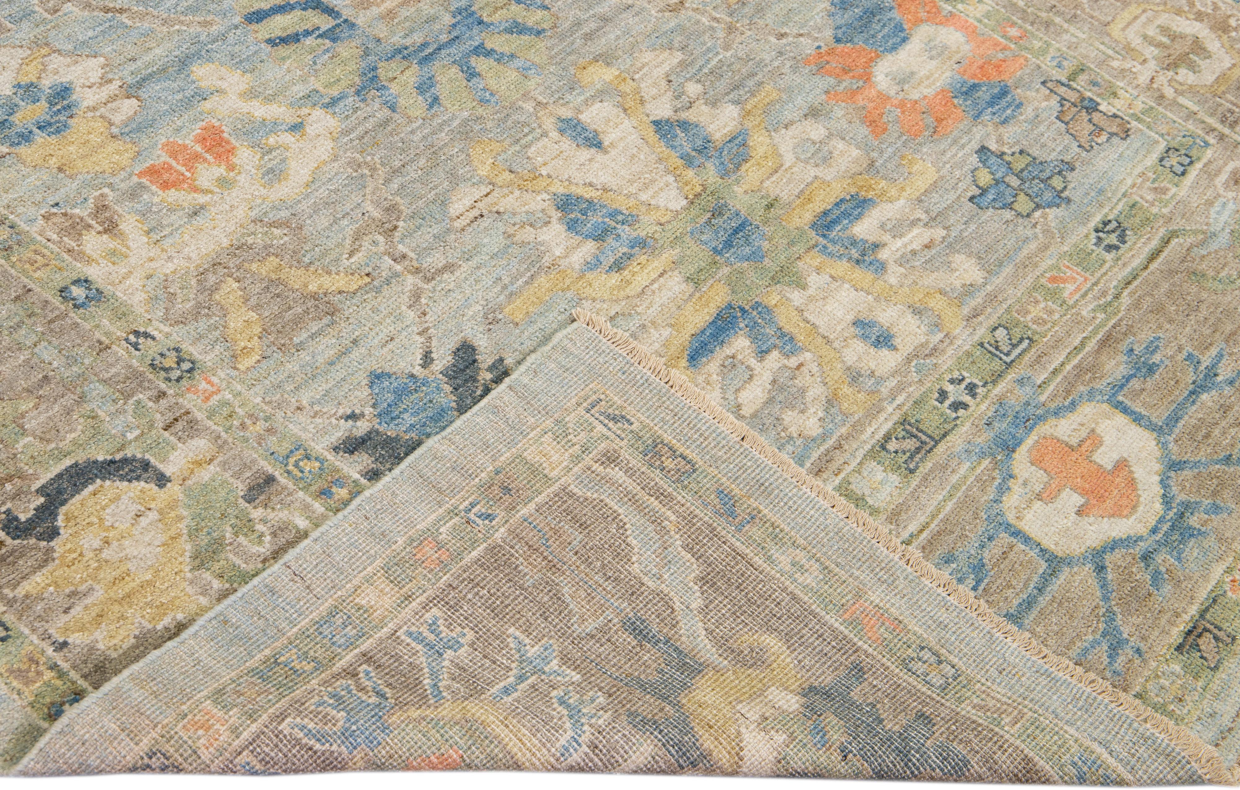 Beautiful modern Mahal hand-knotted wool runner with a blue field. This Piece has yellow, brown, and orange accents in a gorgeous all-over Classic floral design.

This rug measures: 6' x 18'2