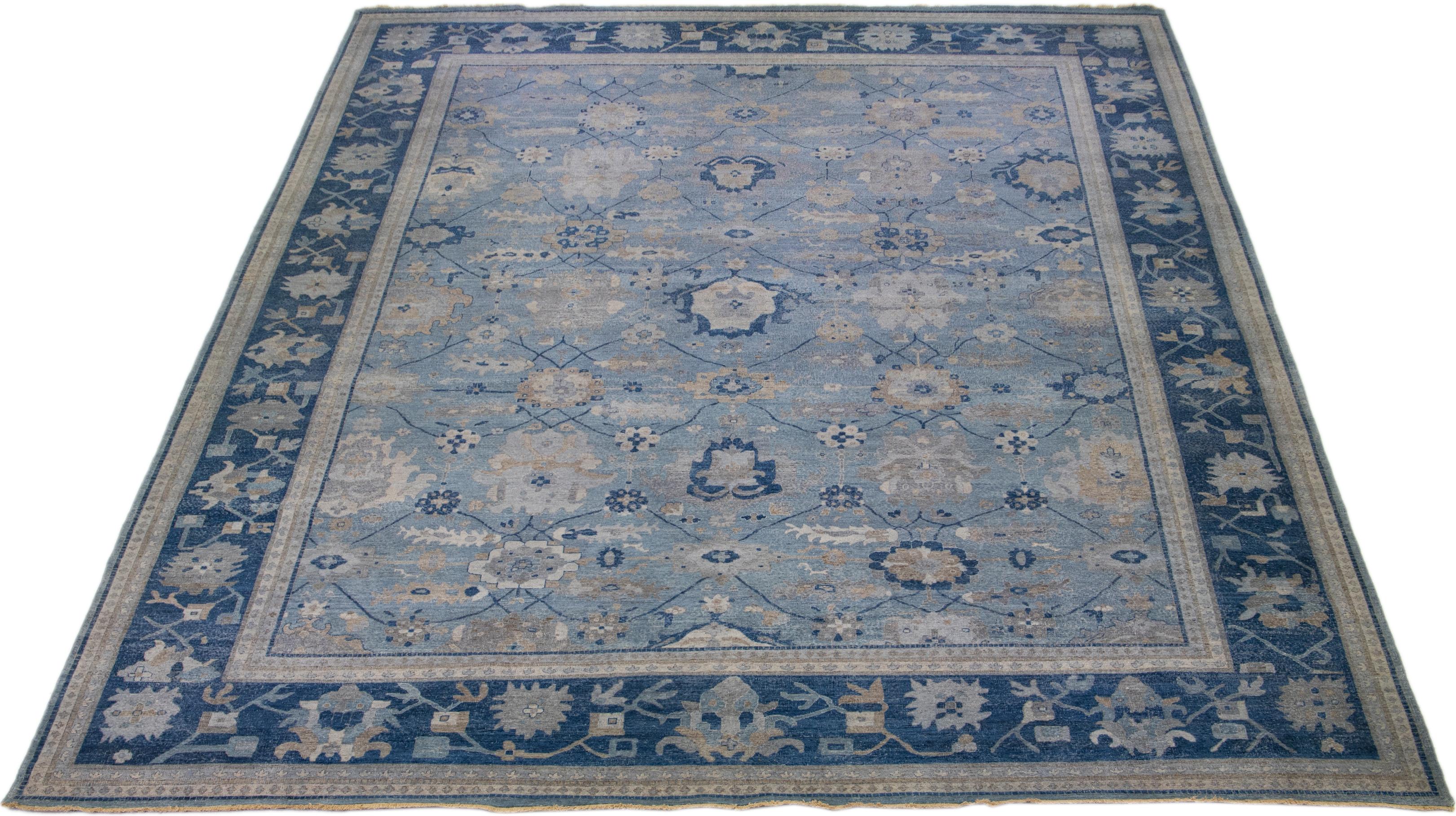 The Artisan line from Apadana brings an exquisite antique style to any space. This hand-knotted rug showcases a beautiful all-over floral pattern with a Blue color scheme and multi-colored accents. It measures 14' 10