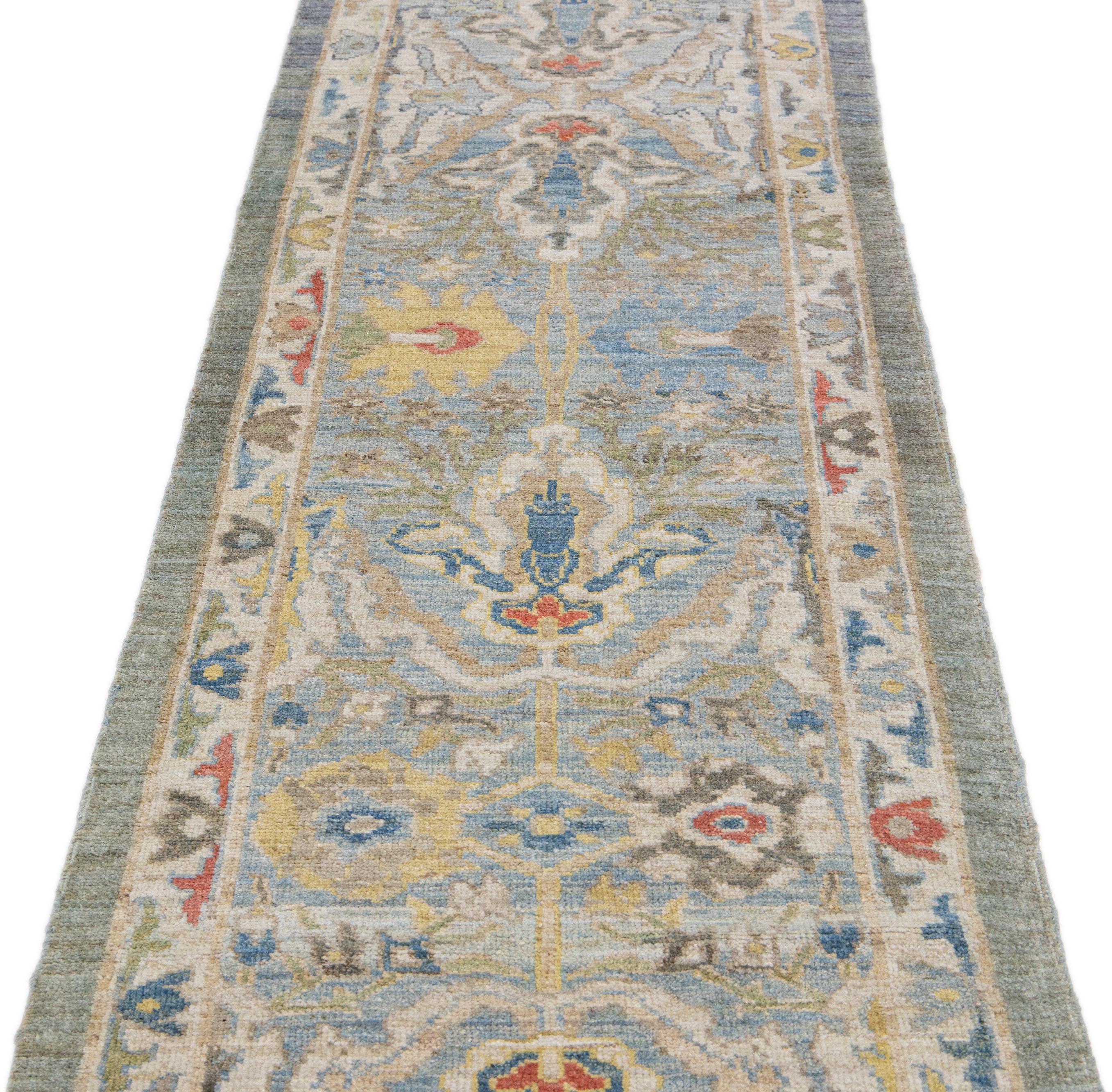 Beautiful modern Mahal hand-knotted wool runner with a blue field. This Piece has a yellow, green, and orange accent in a gorgeous all-over Classic floral design.

This rug measures: 2'7
